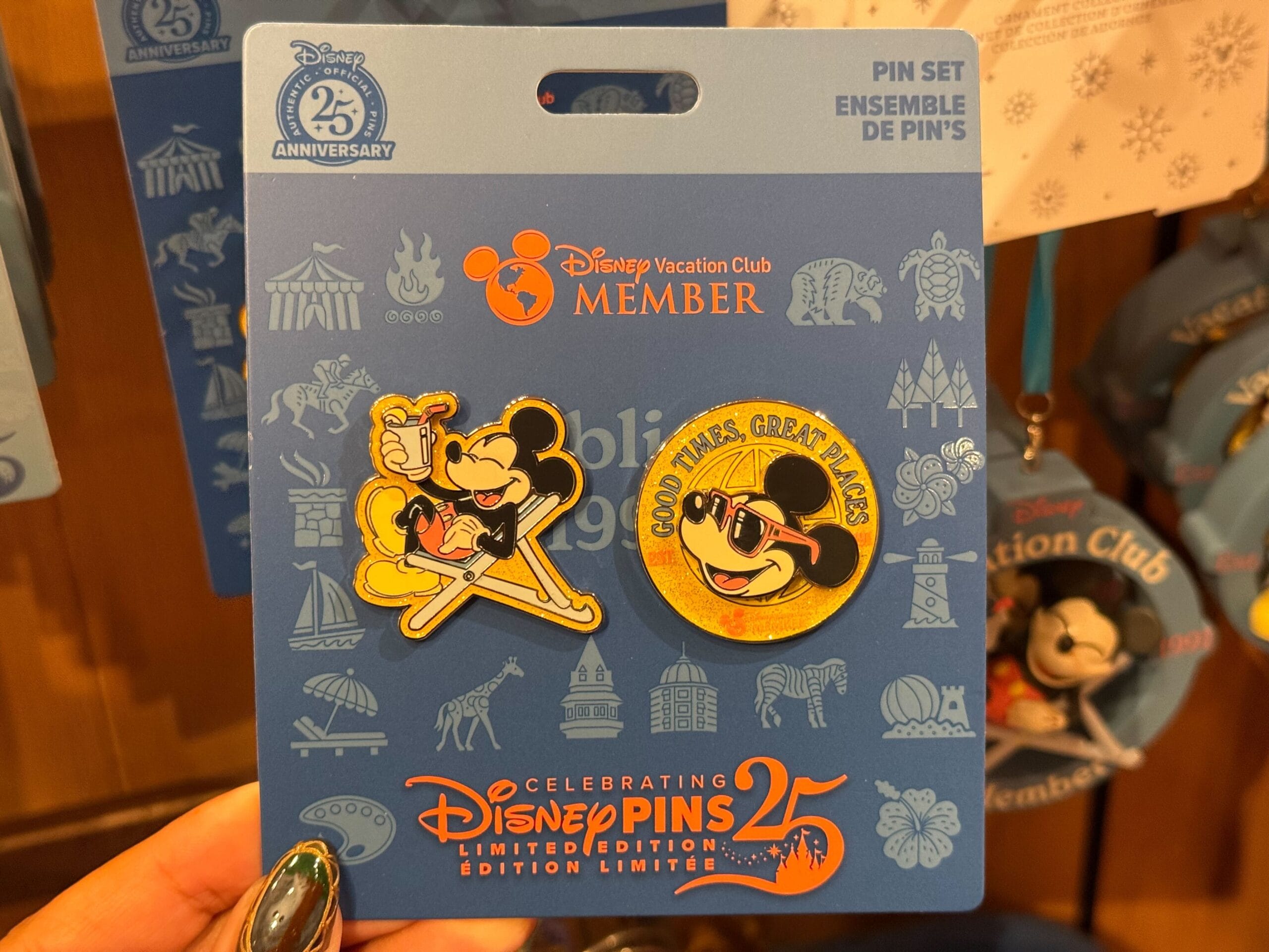 Disney Parks pins with Mickey Mouse in sunglasses, holding ice cream, and "Good Times, Great Places" text, no castle design shown.