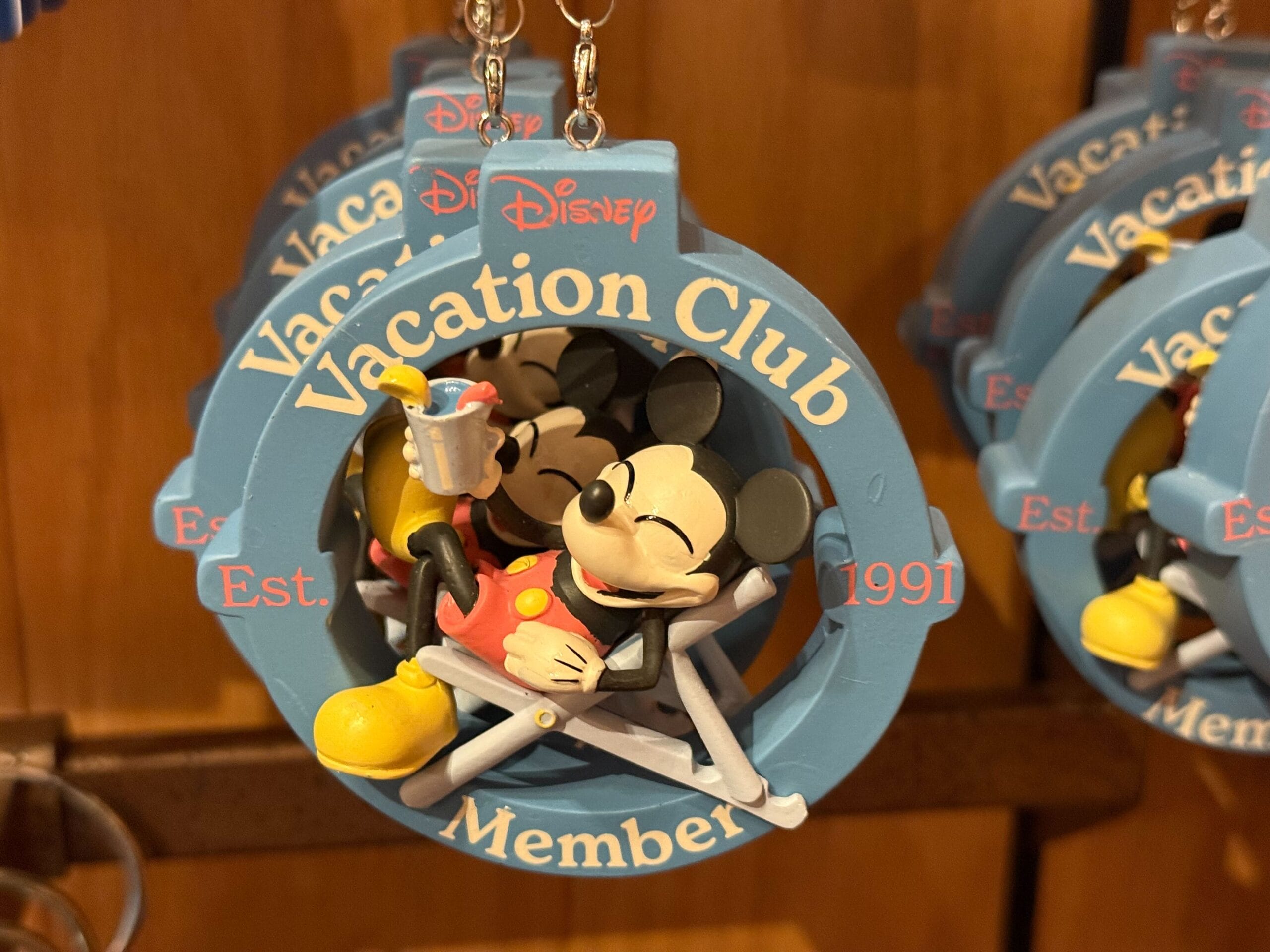 Mickey Mouse lounging with a drink on a DVC Member ornament—must-have merch for any Disney Park fan, especially Disneyland lovers.