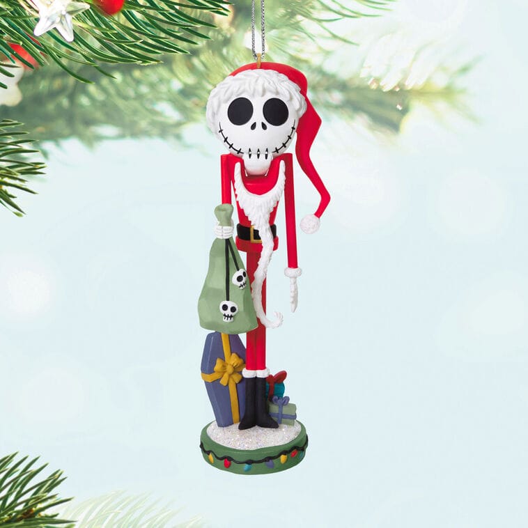 Hallmark Disney Keepsake Ornament of Jack Skellington in a Santa hat with green sack, hanging on a tree—like park holiday decor.