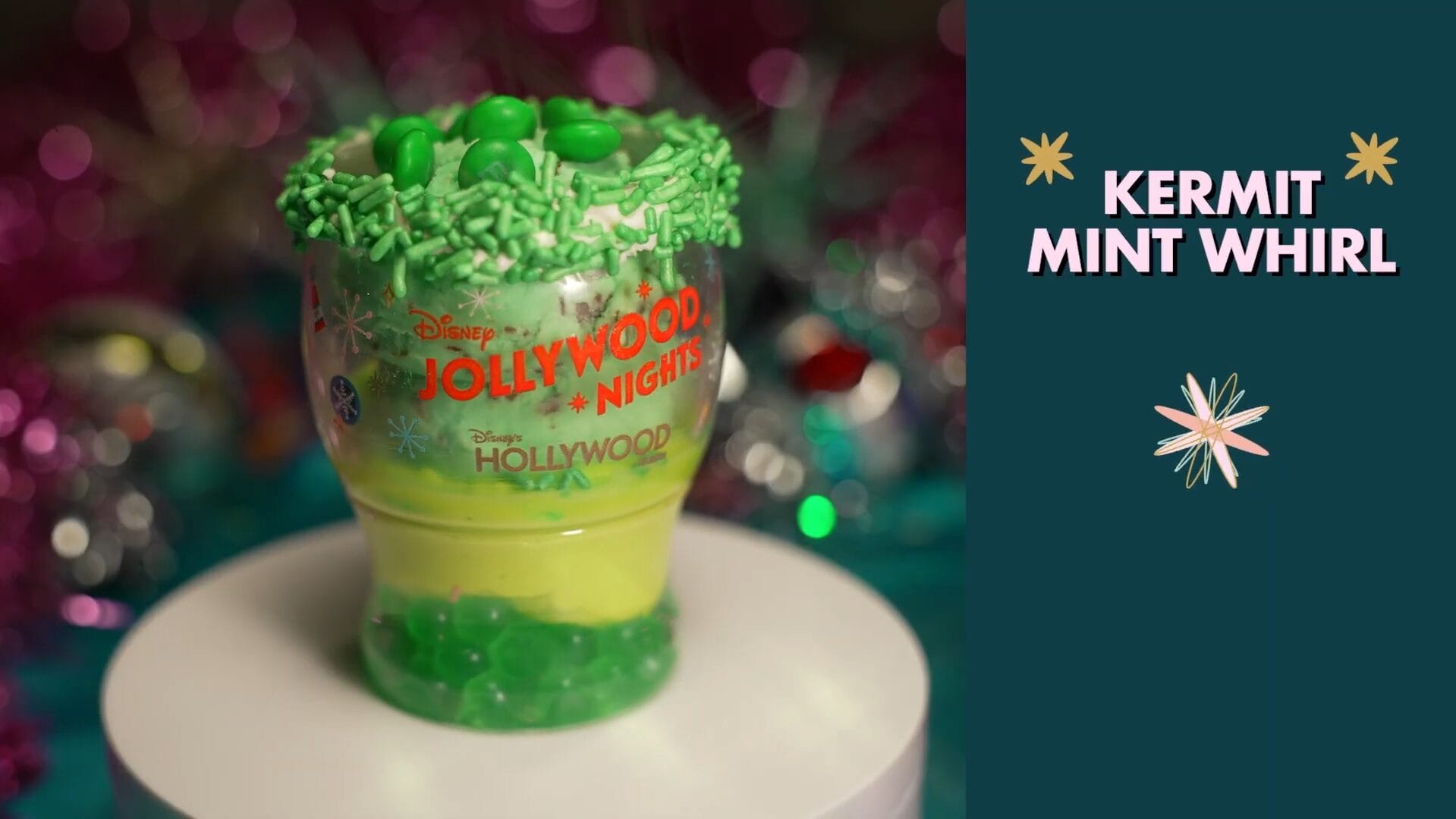 A colorful layered green and yellow dessert cup with sprinkles, a festive new treat featured at Disney Jollywood Nights.