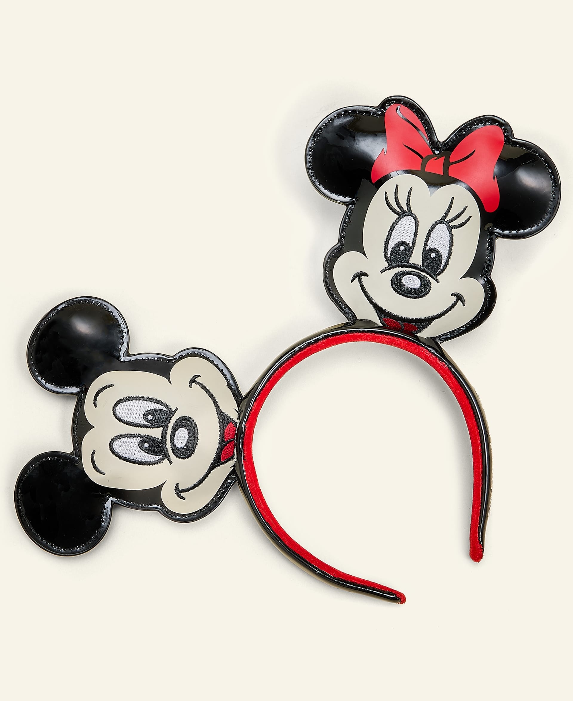 Disney Parks headband from the 2025 Holiday Collection, featuring big Mickey & Minnie faces—Minnie has a red bow.