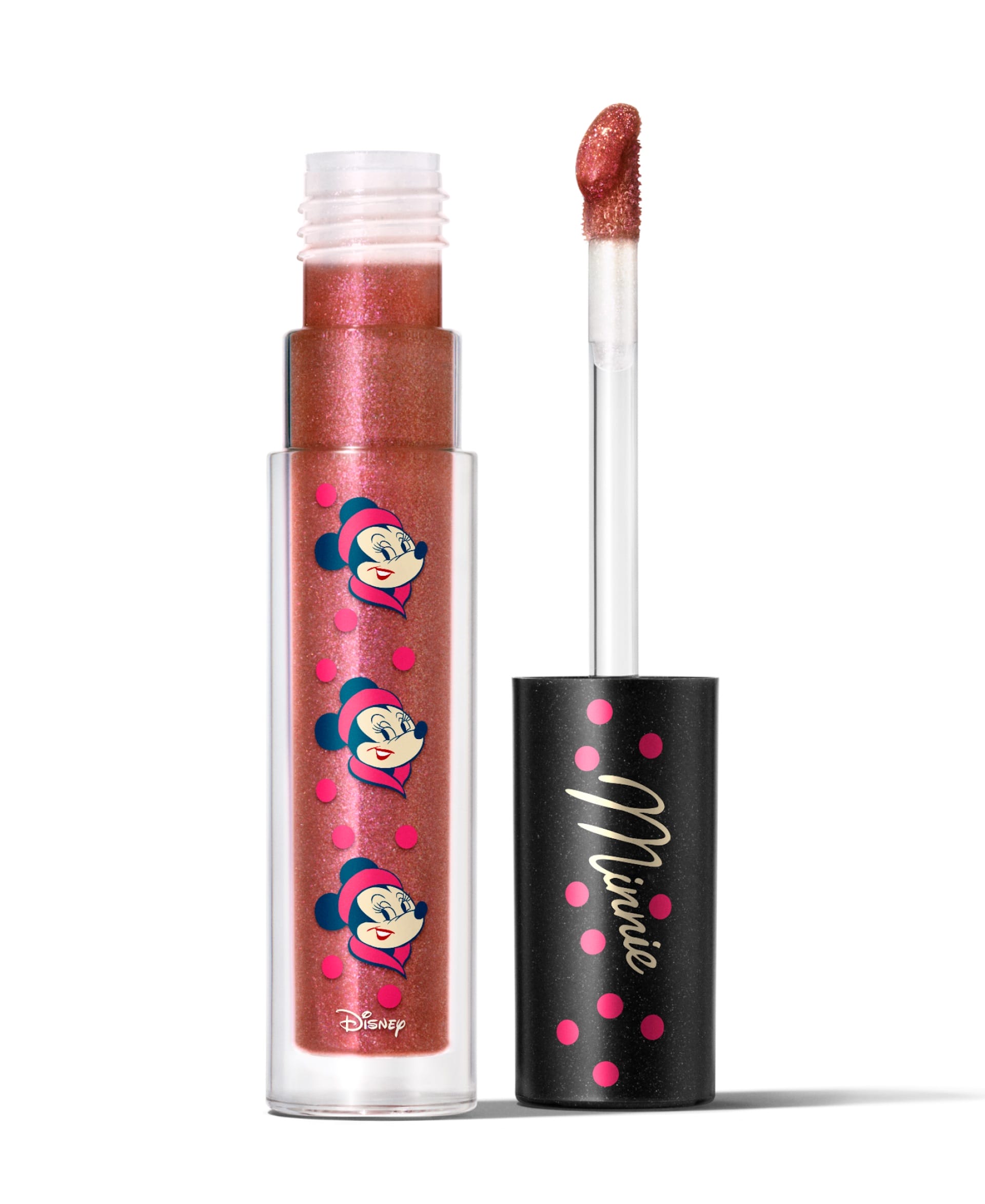 Shimmery pink lip gloss from Disney's 2025 Holiday Collection, with Minnie Mouse faces and a black cap marked "Minnie." No castle featured.