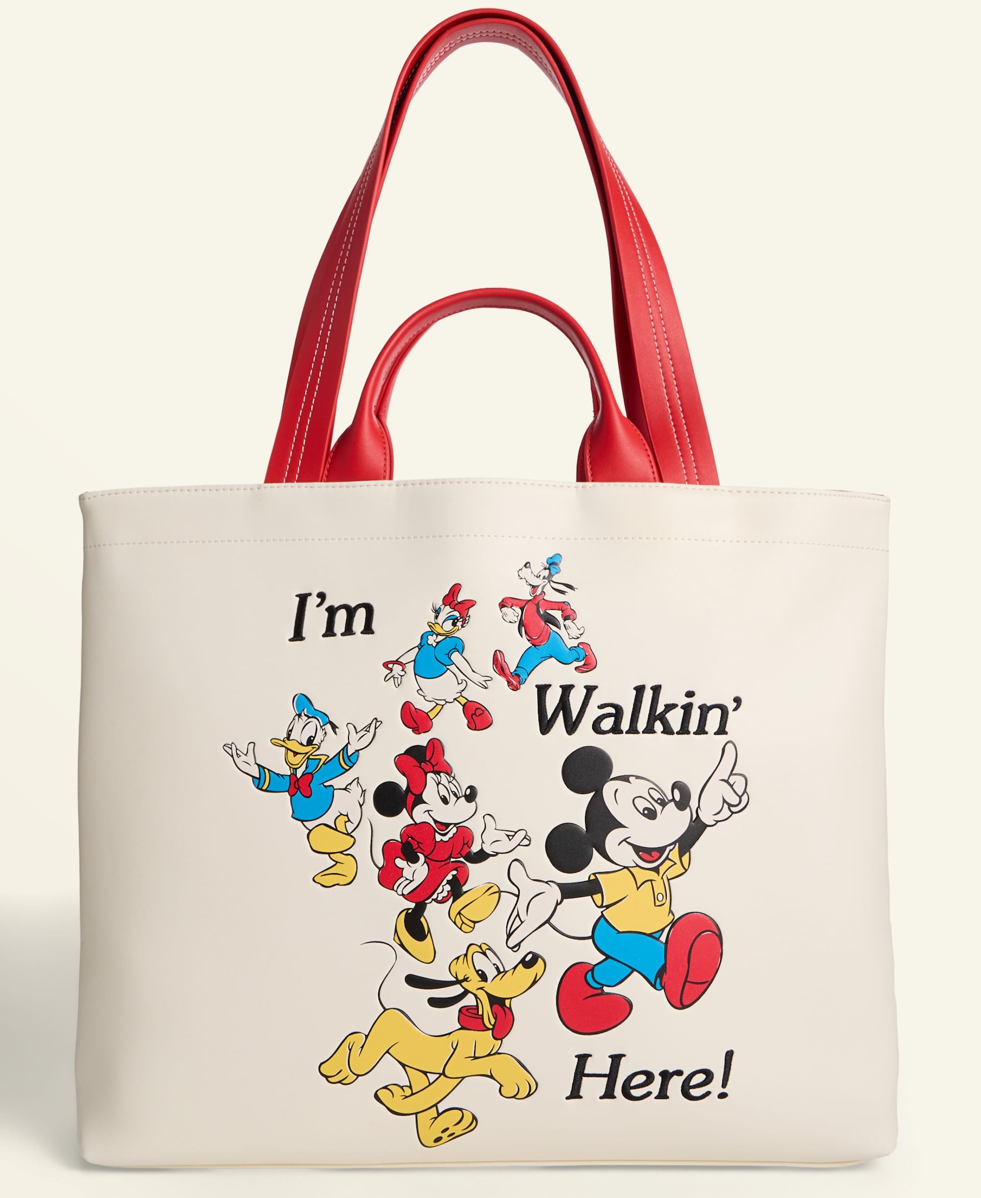 White tote bag with red handles from Macy's Holiday Collection, featuring Mickey, Minnie, Donald, Goofy & Pluto, all Disney Parks icons.