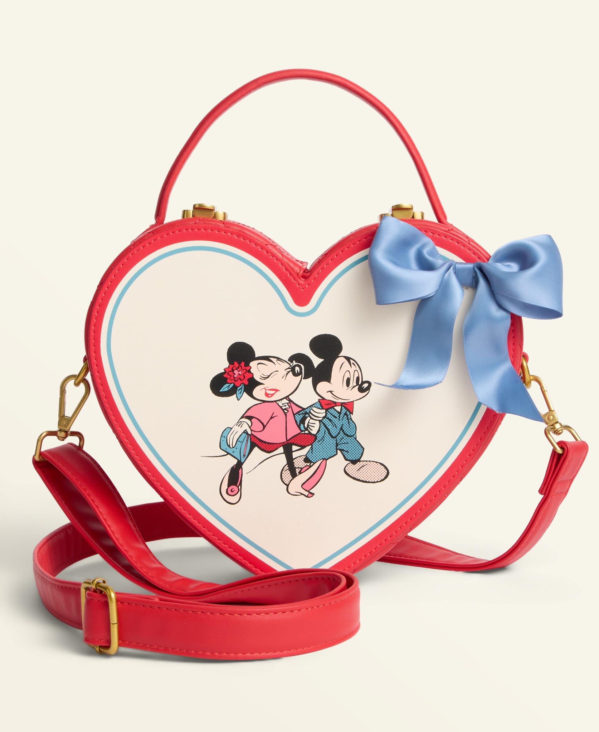 Heart-shaped Disney 2025 Holiday handbag with red trim, blue bow, and Minnie & Mickey, perfect for park souvenirs.