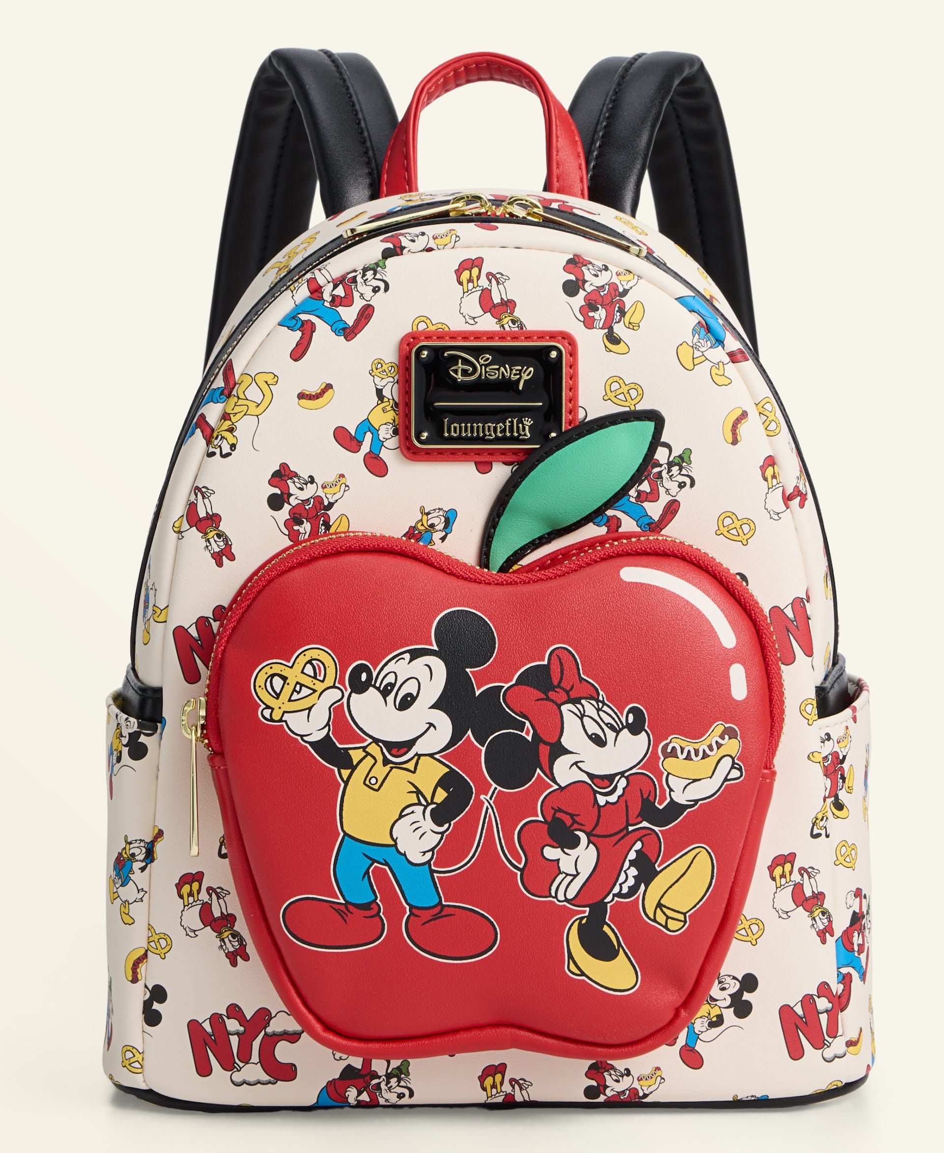 Cream Disney backpack featuring Mickey, Minnie, and NYC icons, from the 2025 Holiday line—no Disney castle visible in design.