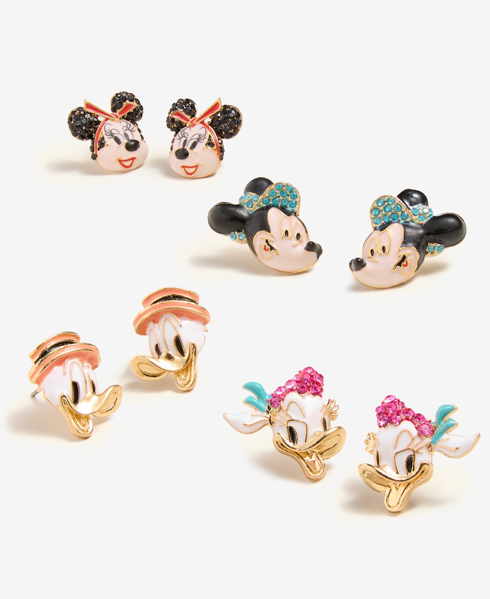 Four pairs of Disney stud earrings from the 2025 Holiday Collection, with Minnie, Mickey, Donald & Daisy Duck—iconic Disney Parks characters.