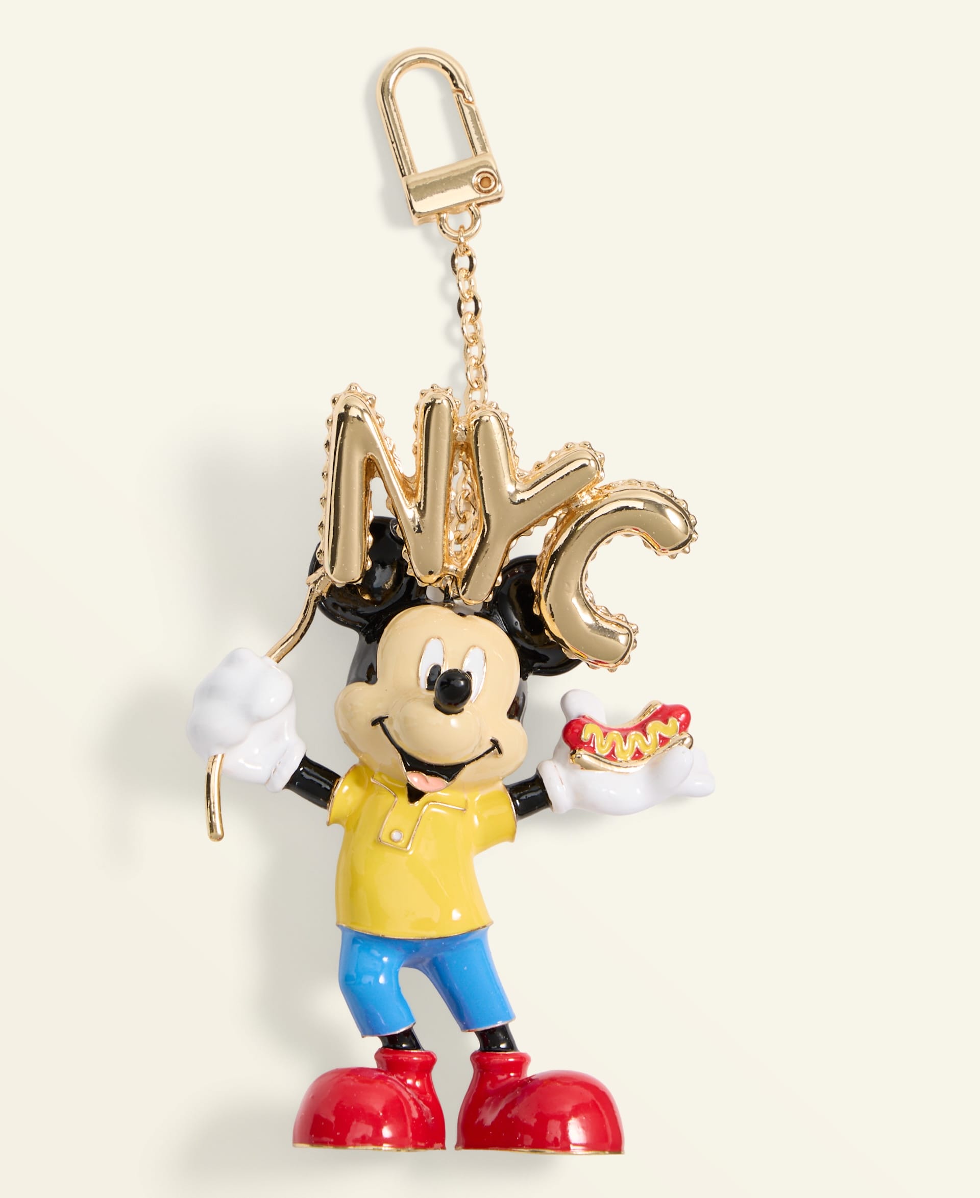 Disney-style cartoon mouse keychain holding gold "NYC" balloons, part of the 2025 Holiday Collection at Disney Parks.