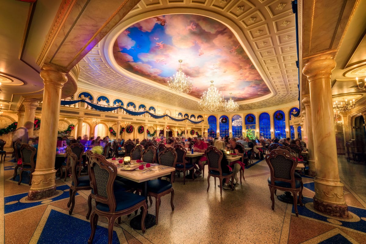 Elegant restaurant with chandeliers and painted ceiling, reminiscent of a Jane Goodall daily recap in sophistication.
