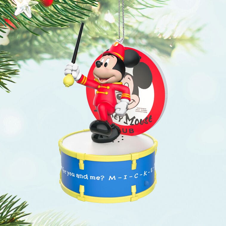 Mickey Mouse as a drum major stands on a blue drum in this Hallmark ornament, recalling Main Street parades at Disney parks.