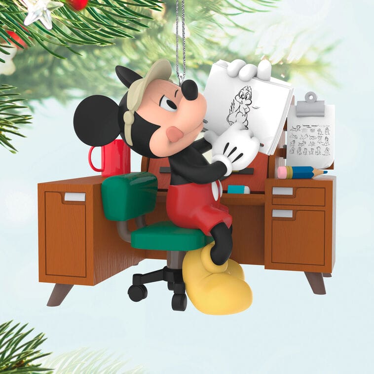 Mickey Mouse sketches Minnie at his desk, festive decor around, like Main Street’s holiday charm in Disney Parks worldwide.