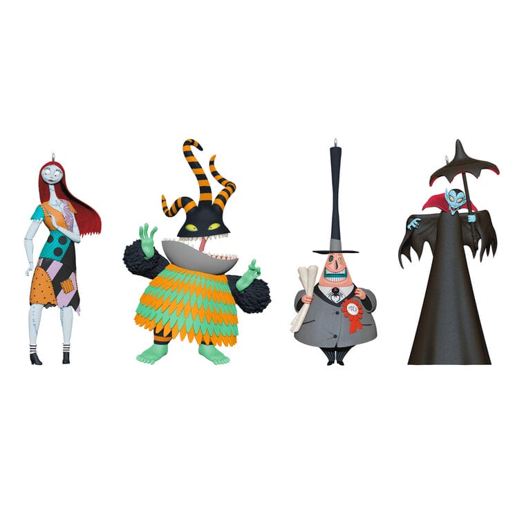 Four stylized Nightmare Before Christmas Disney ornaments stand side by side, reminiscent of unique keepsakes from Disney Parks.