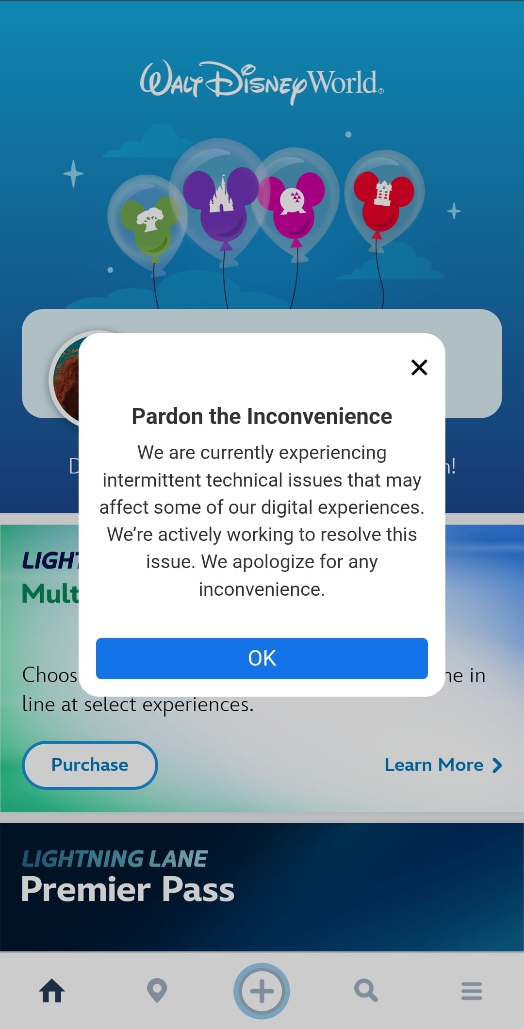 A Walt Disney World app displays an outage pop-up about Dining Reservations, with an OK button—no castle imagery shown here.