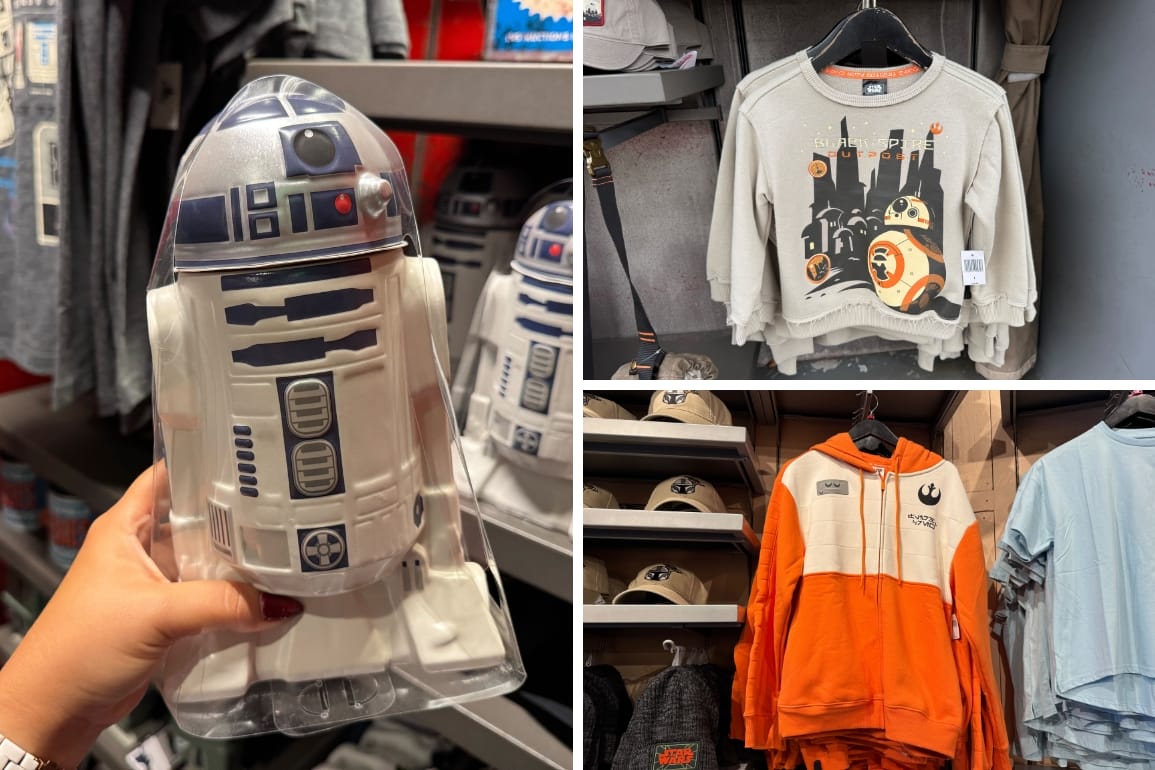 A hand holds an R2-D2 toy; Star Wars merch and sweatshirts are displayed on racks at Hollywood Studios.