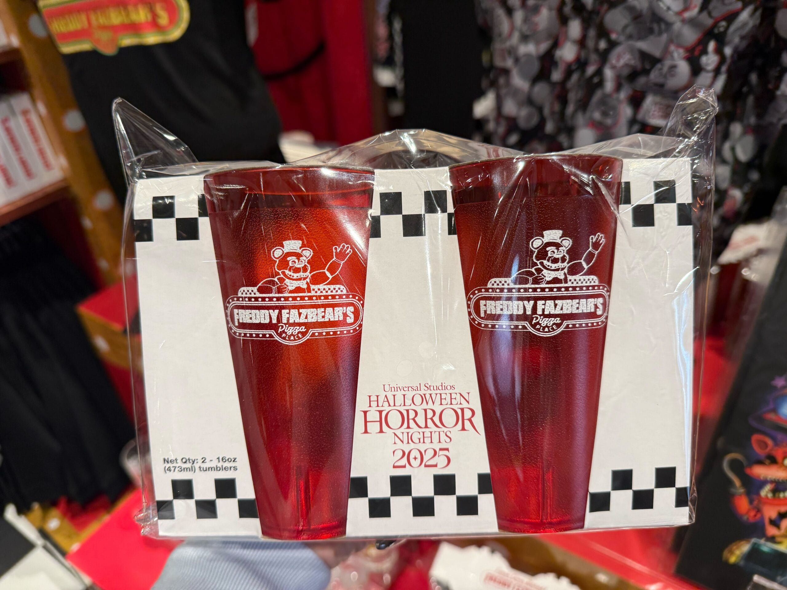 Two red plastic Freddy Fazbear’s Pizza Place glasses, 2025 Halloween Horror Nights merch at Universal.