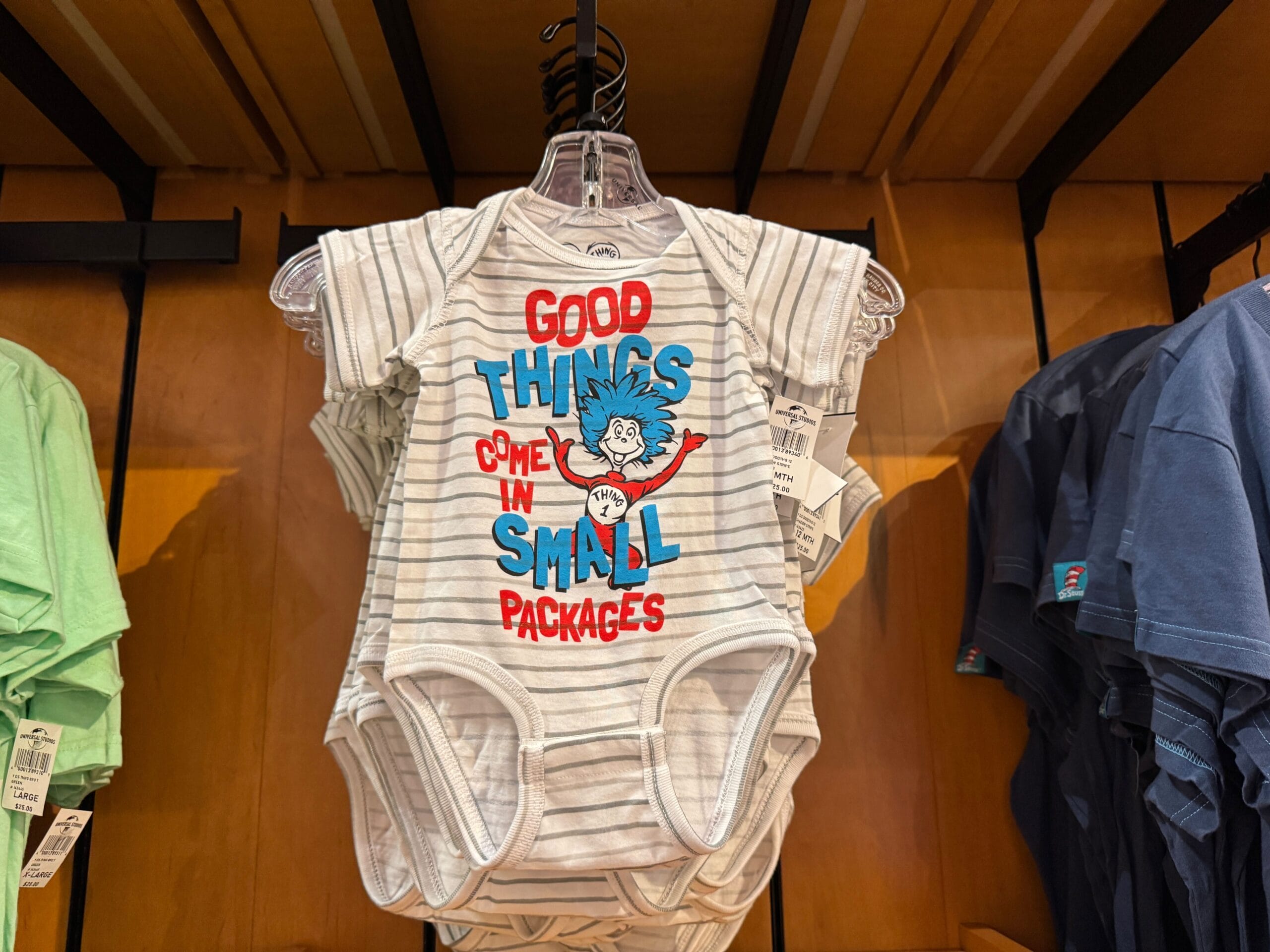Striped baby onesie featuring a Dr. Seuss character, playful like Disney Parks gear—your own little Thing 1 or Thing 2 ready for magic!