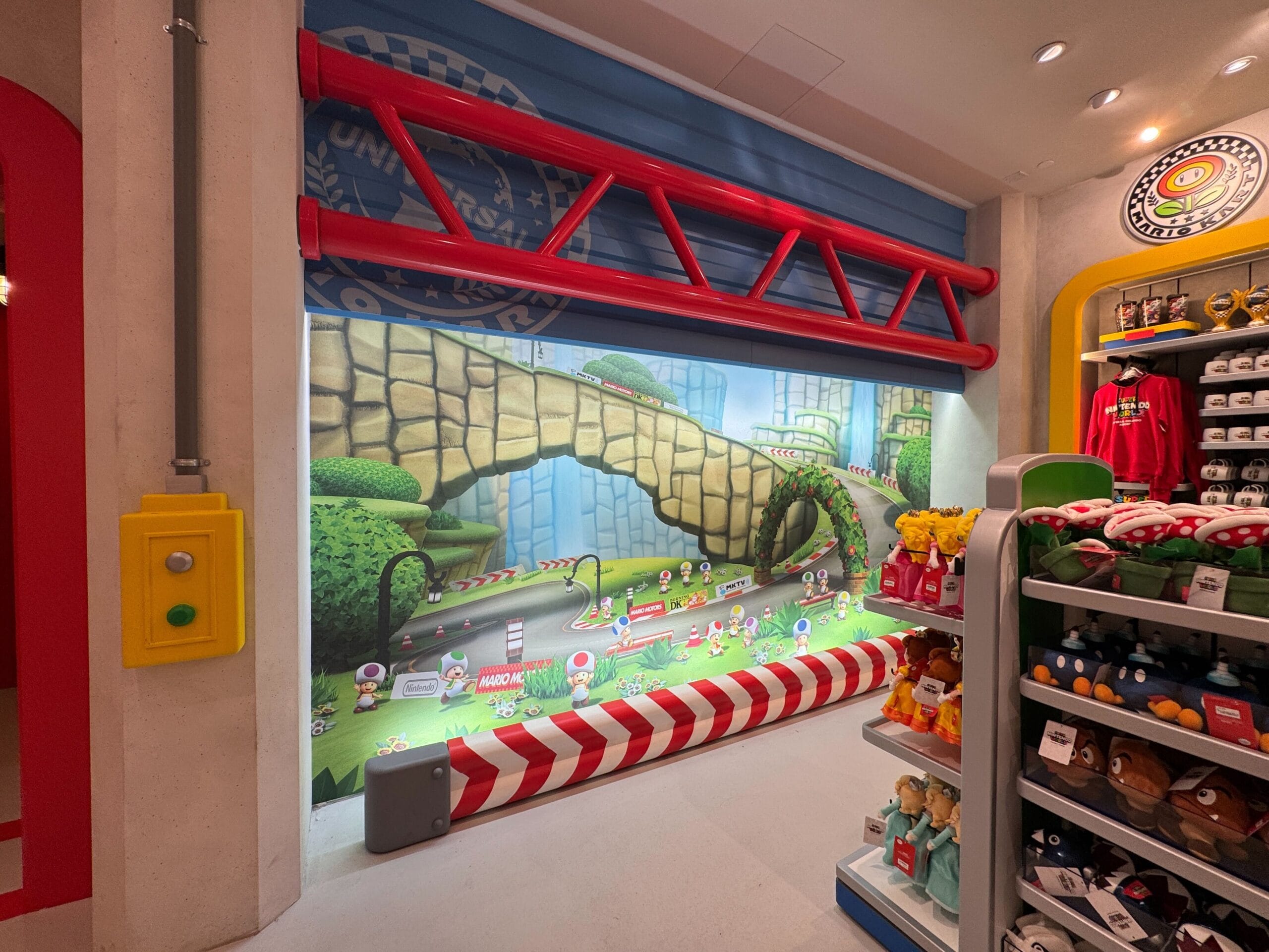 Vibrant Super Nintendo World store wall with Mario Kart mural, character toys, and Epic Universe displays, unlike any Disney castle.