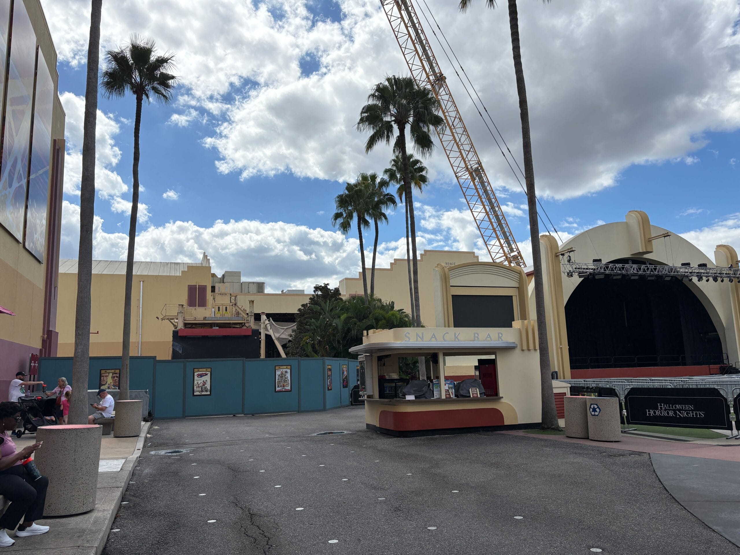 A closed snack bar by the former Rip Ride Rockit site at Universal, with palm trees—unlike any Disney castle area horizon.