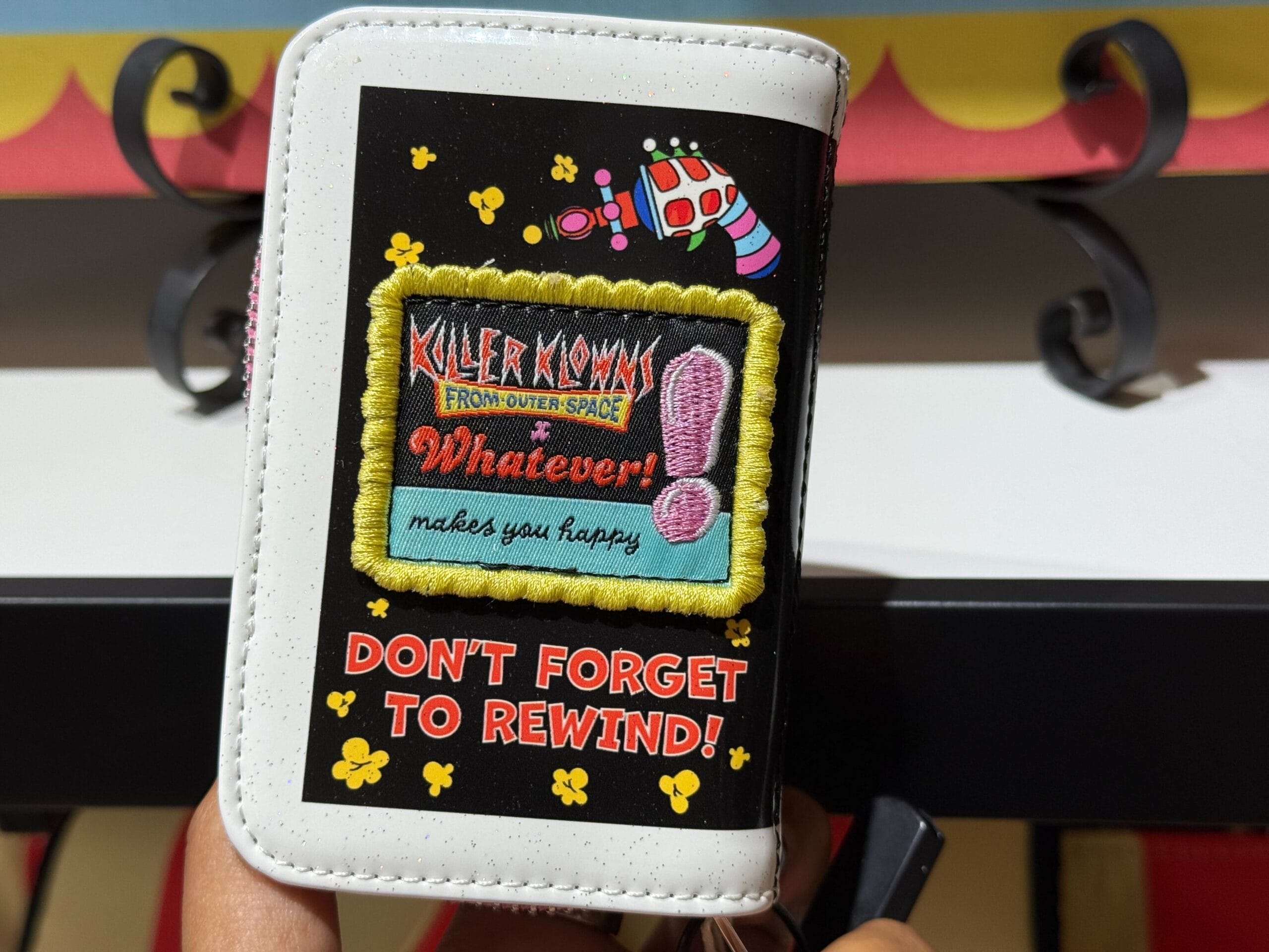 A wallet with "Killer Klowns from Outer Space" design.