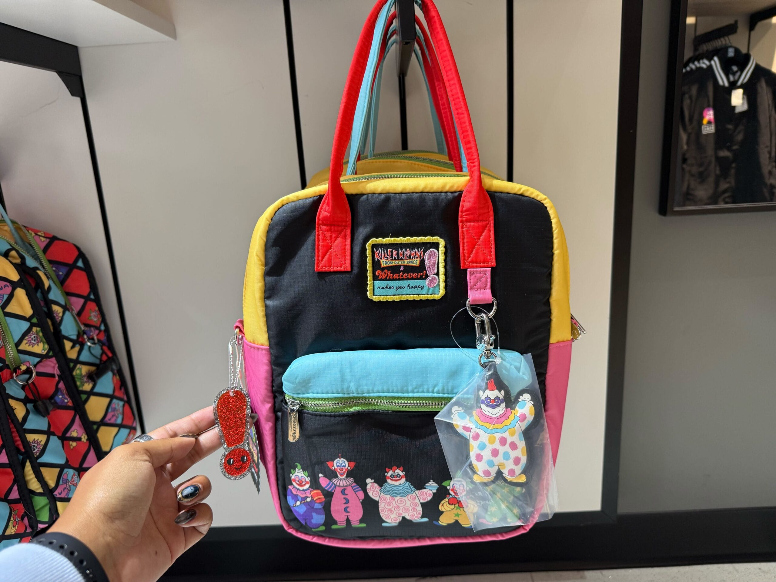 Colorful cartoon bag themed to Killer Klowns from Outer Space with a clown bag charm.