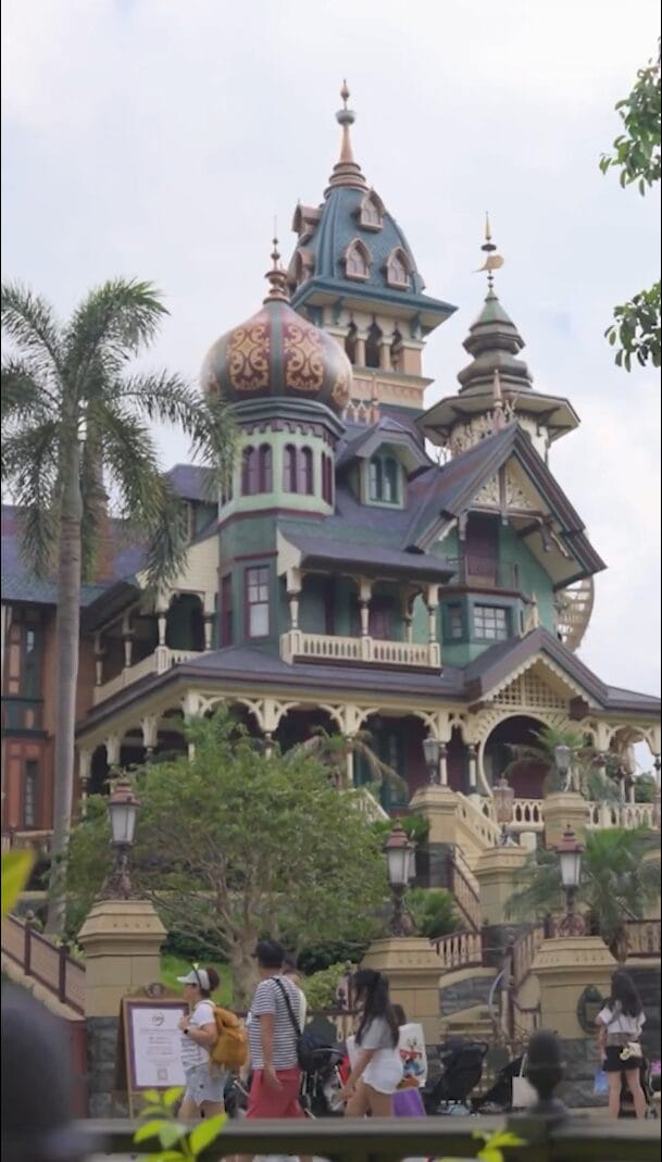 The colorful, onion-domed, Victorian-inspired facade of Mystic Manor in Hong Kong Disneyland.