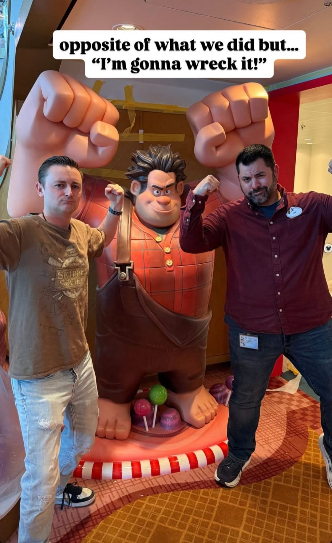Two men flex by a big Wreck-It Ralph statue, grinning. Above, "I'm gonna wreck it!"