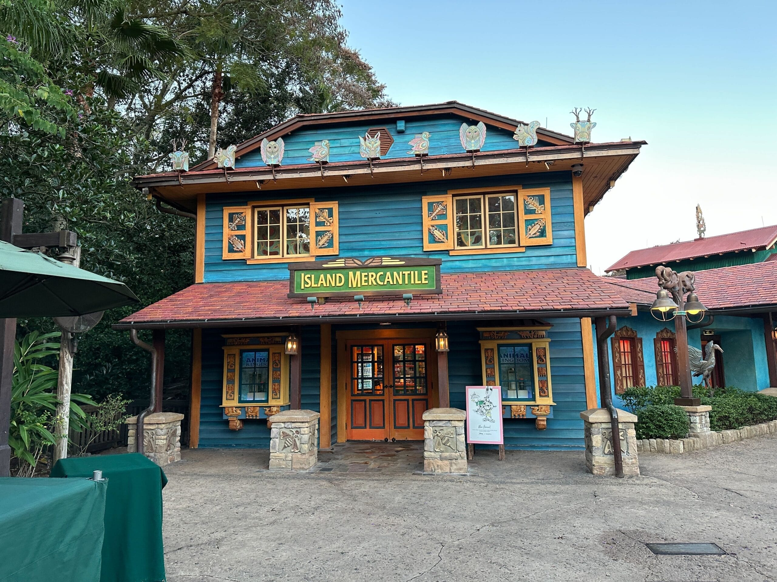 A vibrant two-story Island Mercantile shop at Disney’s Animal Kingdom, decorated with animals and a Daily Recap sign out front.