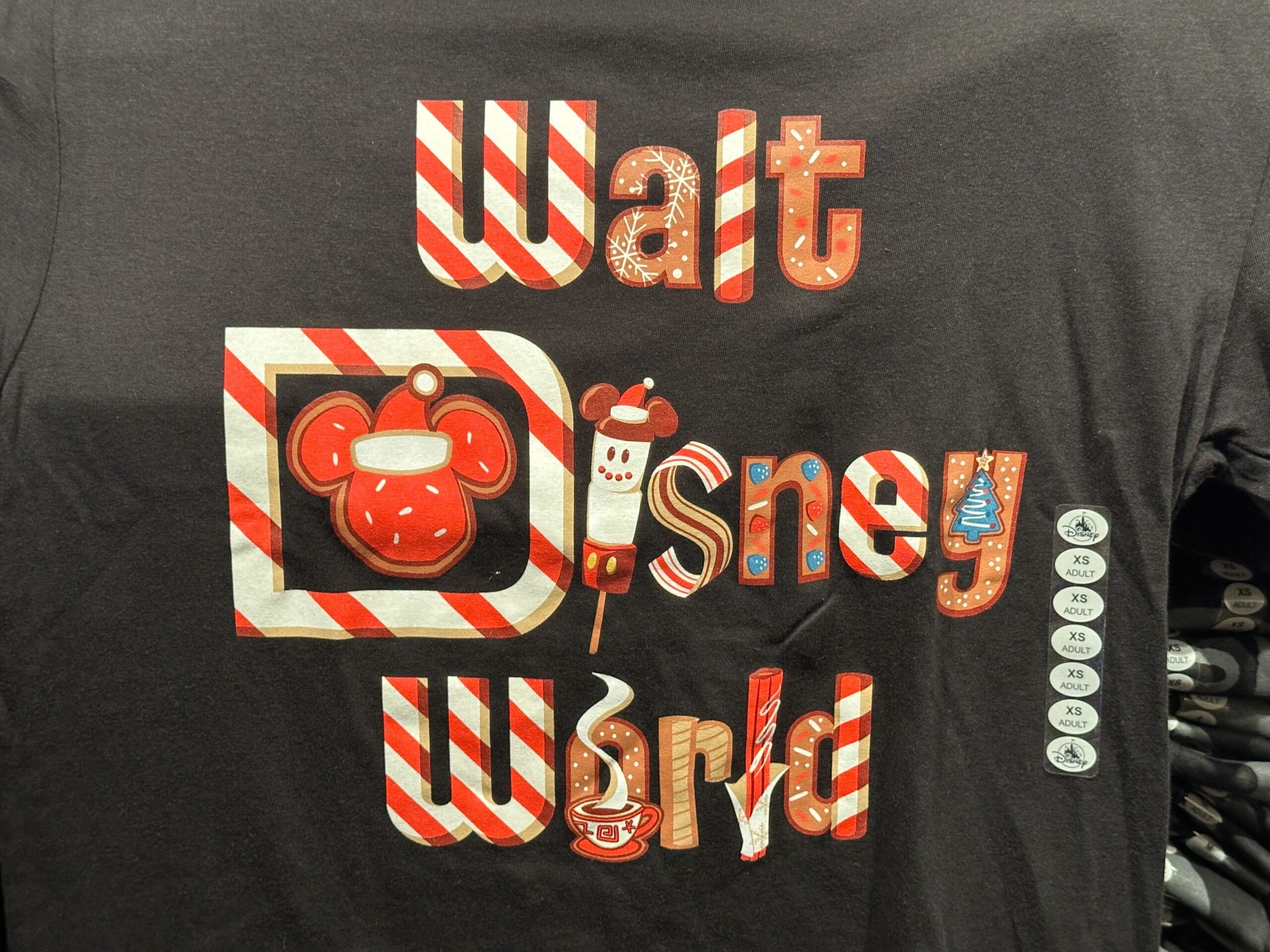 Black Disney World holiday shirt with "Walt Disney World" in candy-themed letters