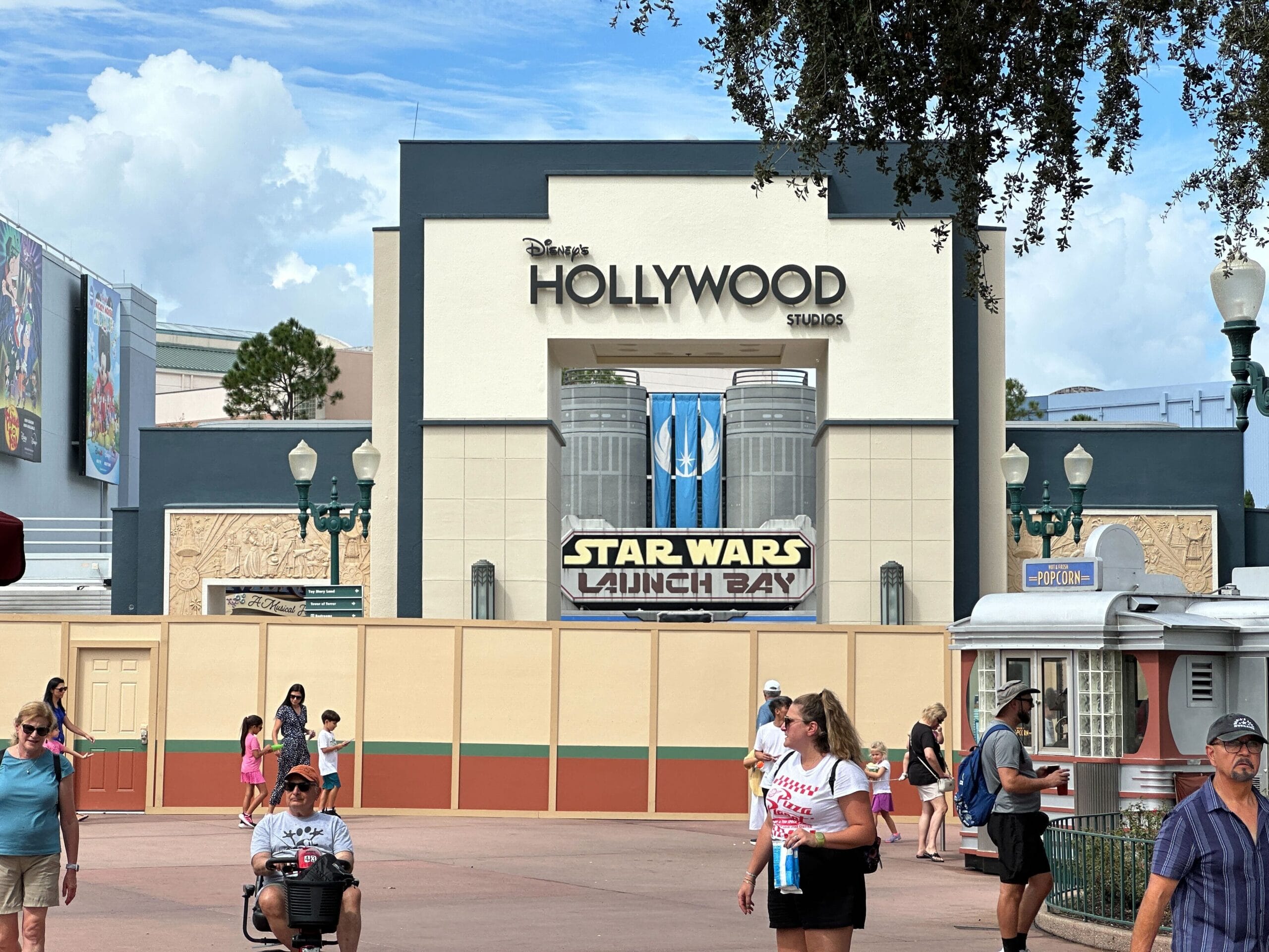 Entrance to Star Wars Launch Bay in Animation Courtyard, Disney's Hollywood Studios, with construction walls and visiting guests.