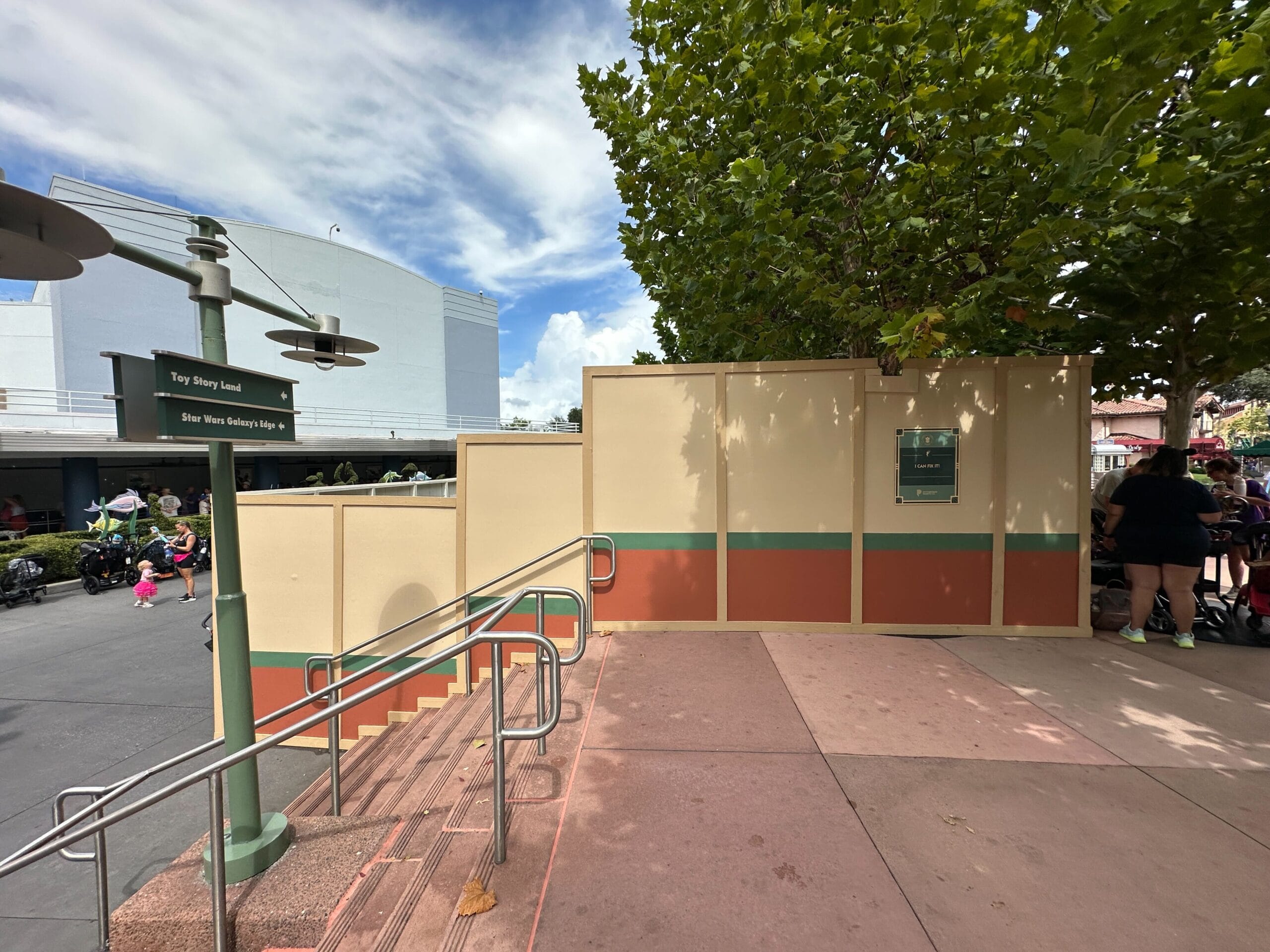 Construction walls block an entrance by the stairs in Animation Courtyard at Disney's Hollywood Studios; no castle visible here.