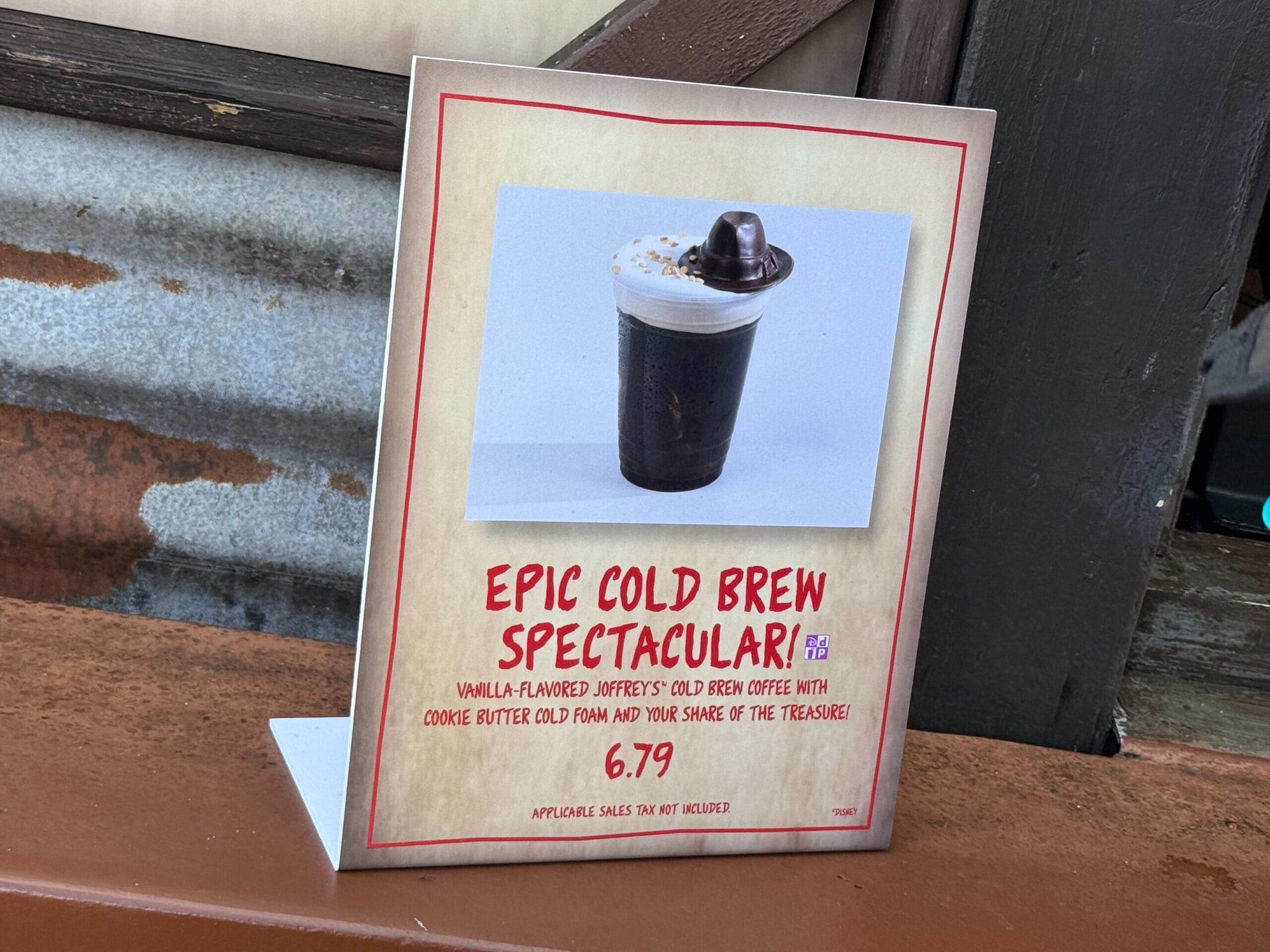 A sign at Disney's Hollywood Studios highlights the Epic Cold Brew—vanilla, cookie butter hat, whipped cream—for $6.79.