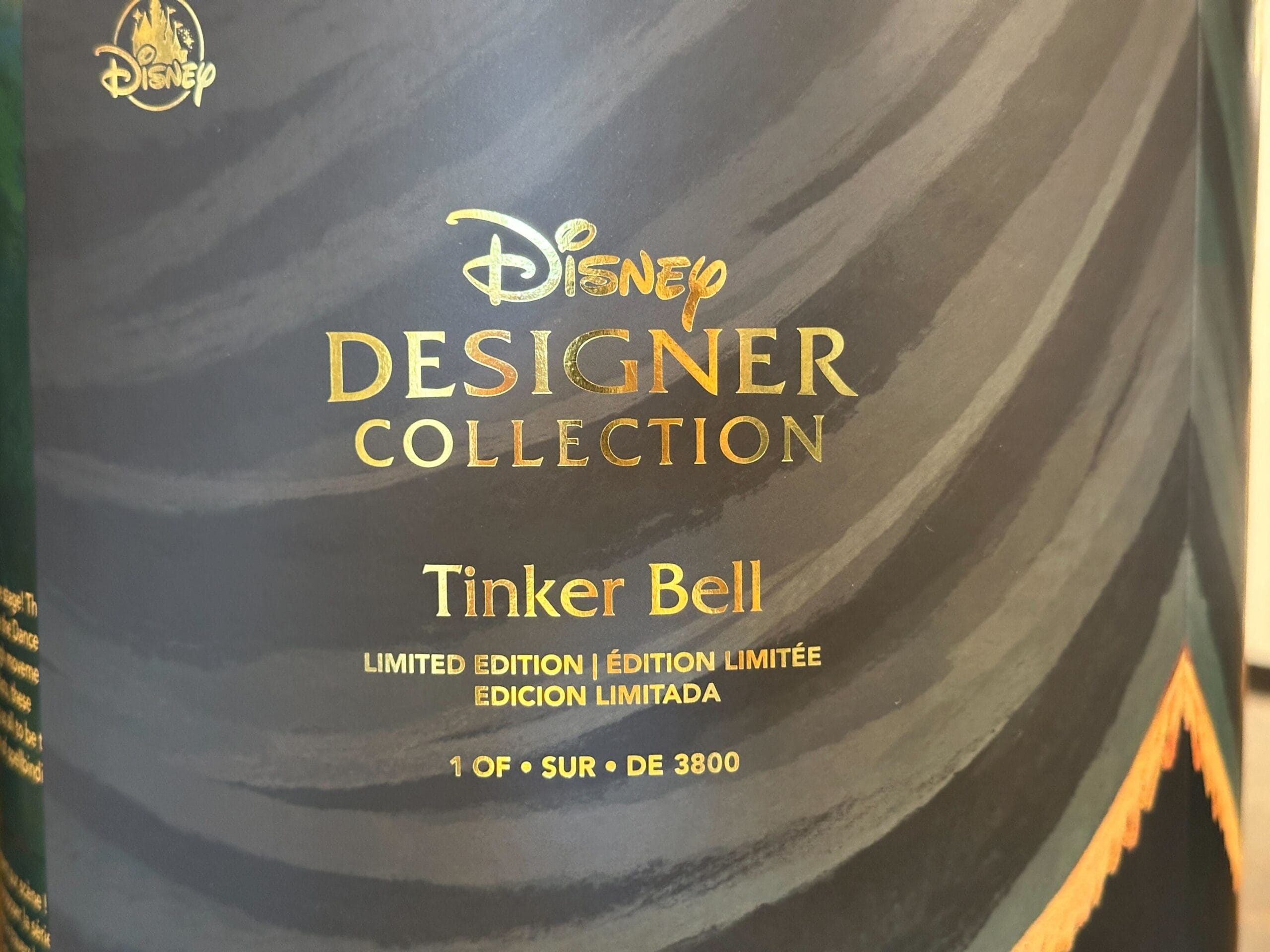 Close-up of Disney Designer Tinker Bell Collection box, limited to 1 of 3800, seen at a Disney park gift shop. No castle visible.