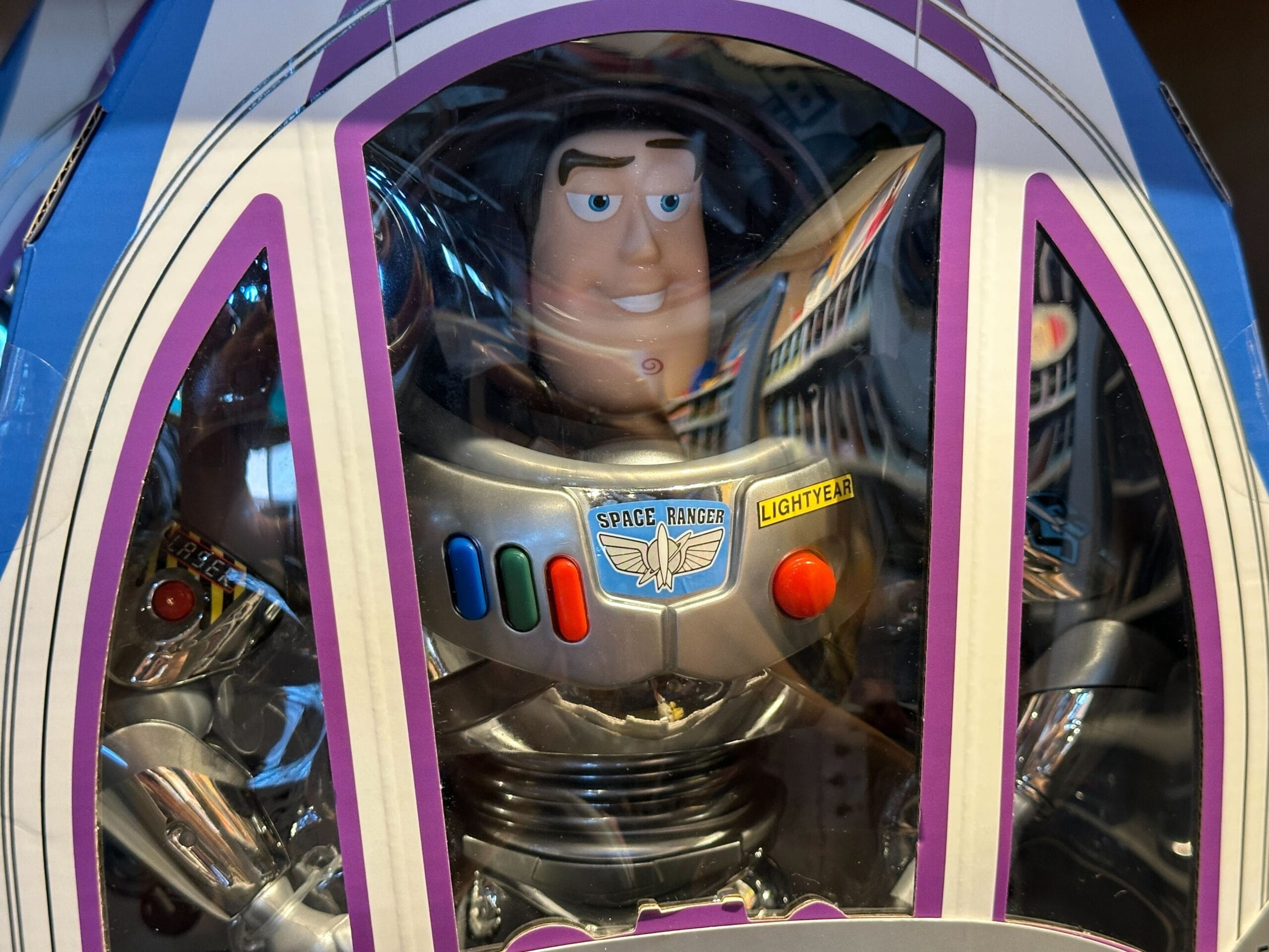 Toy Story 30th Anniversary Buzz Lightyear figure in original packaging with "Space Ranger" badge, like park merchandise.