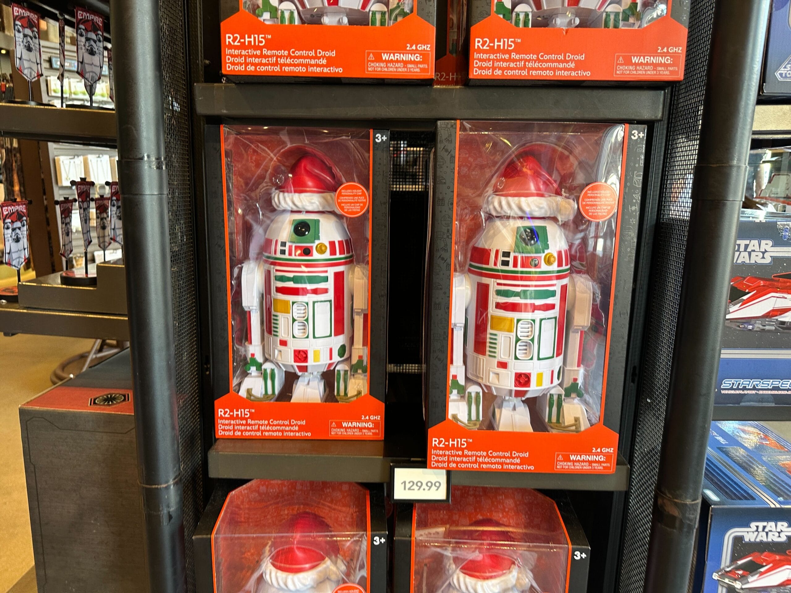 Disney Parks remote control R2-H15 droid toys in festive Christmas colors, ideal for Star Wars fans, $129.99—no castle included.
