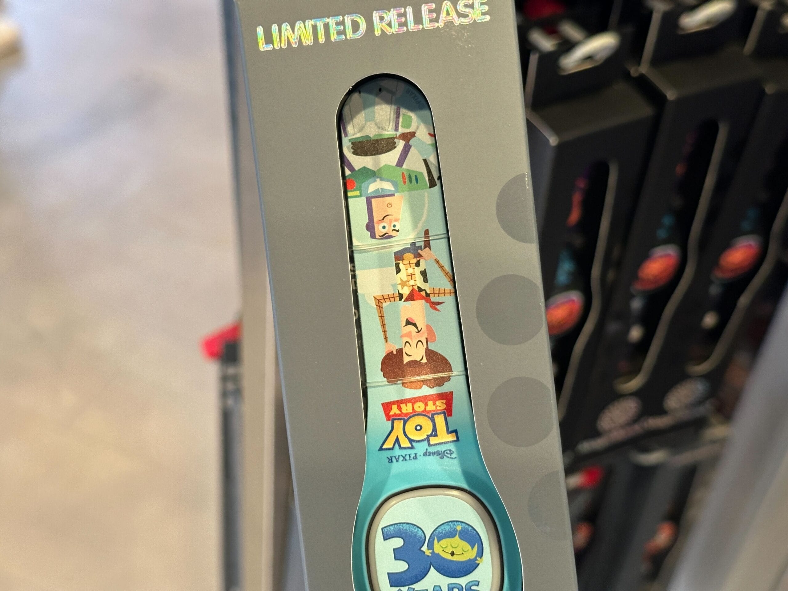 A limited release Toy Story 30th anniversary MagicBand+ featuring Woody, Buzz, and Forky.