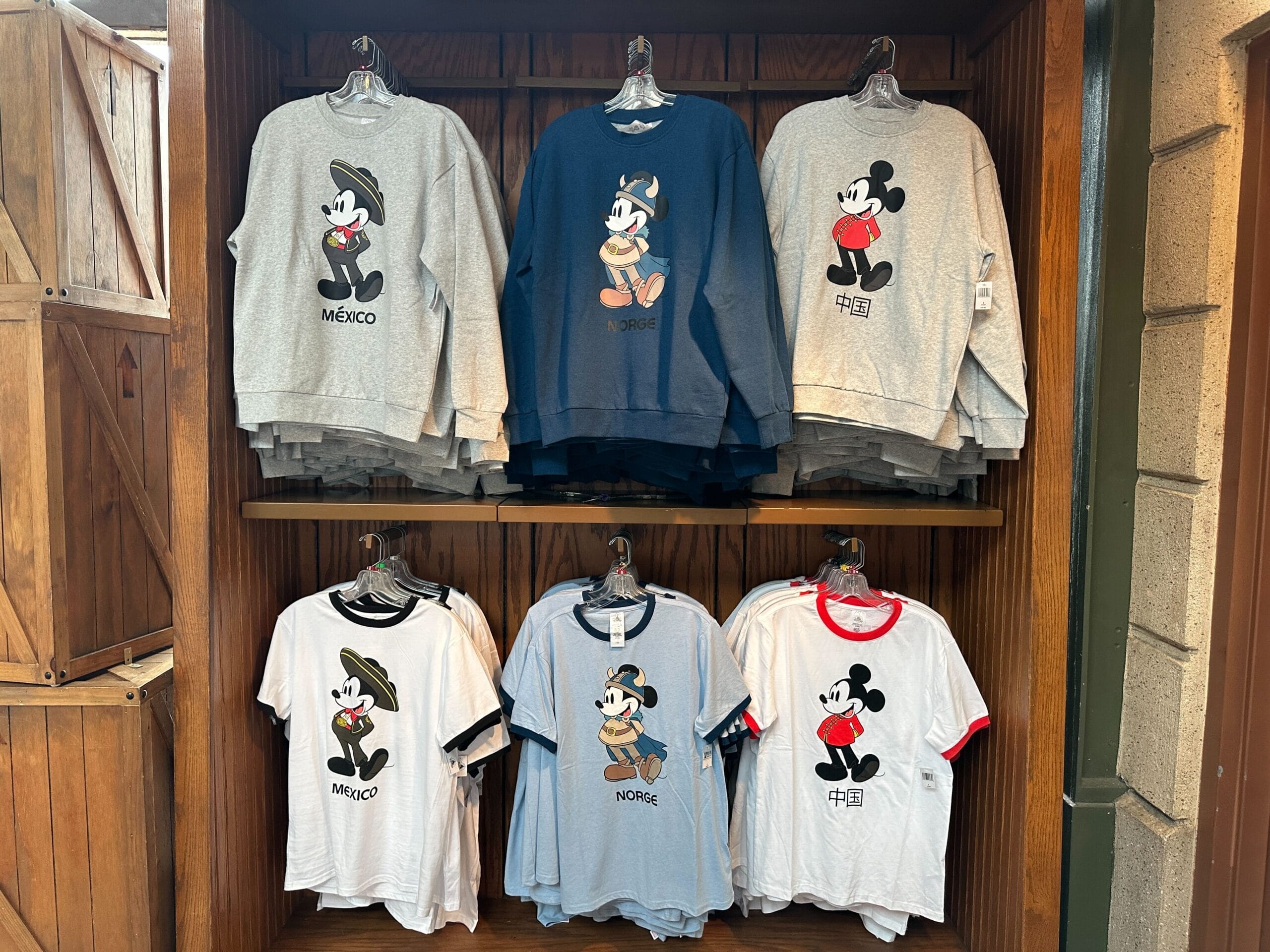 Six Mickey Mouse shirts from the Sweatshirt Collection on display; “México,” “Norte,” or “China” label and design.