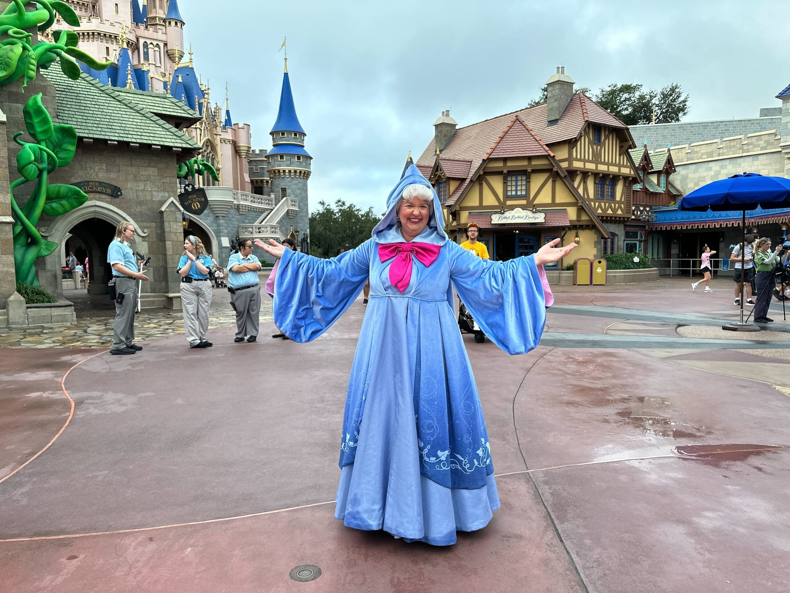 The Fairy Godmother smiles in the middle of Fantasyland at Magic Kingdom in Walt Disney World.