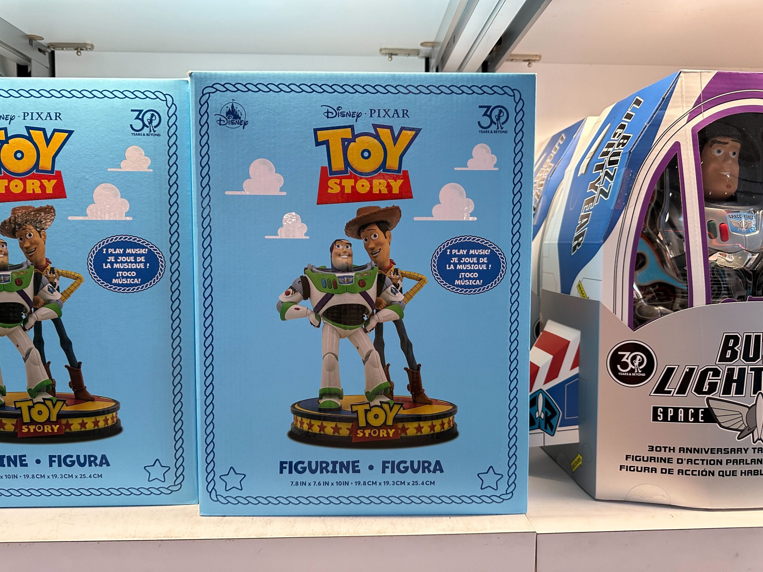 Toy Story figurine box with Woody and Buzz Lightyear, 30th Anniversary edition, similar to merchandise found at Disney Parks worldwide.