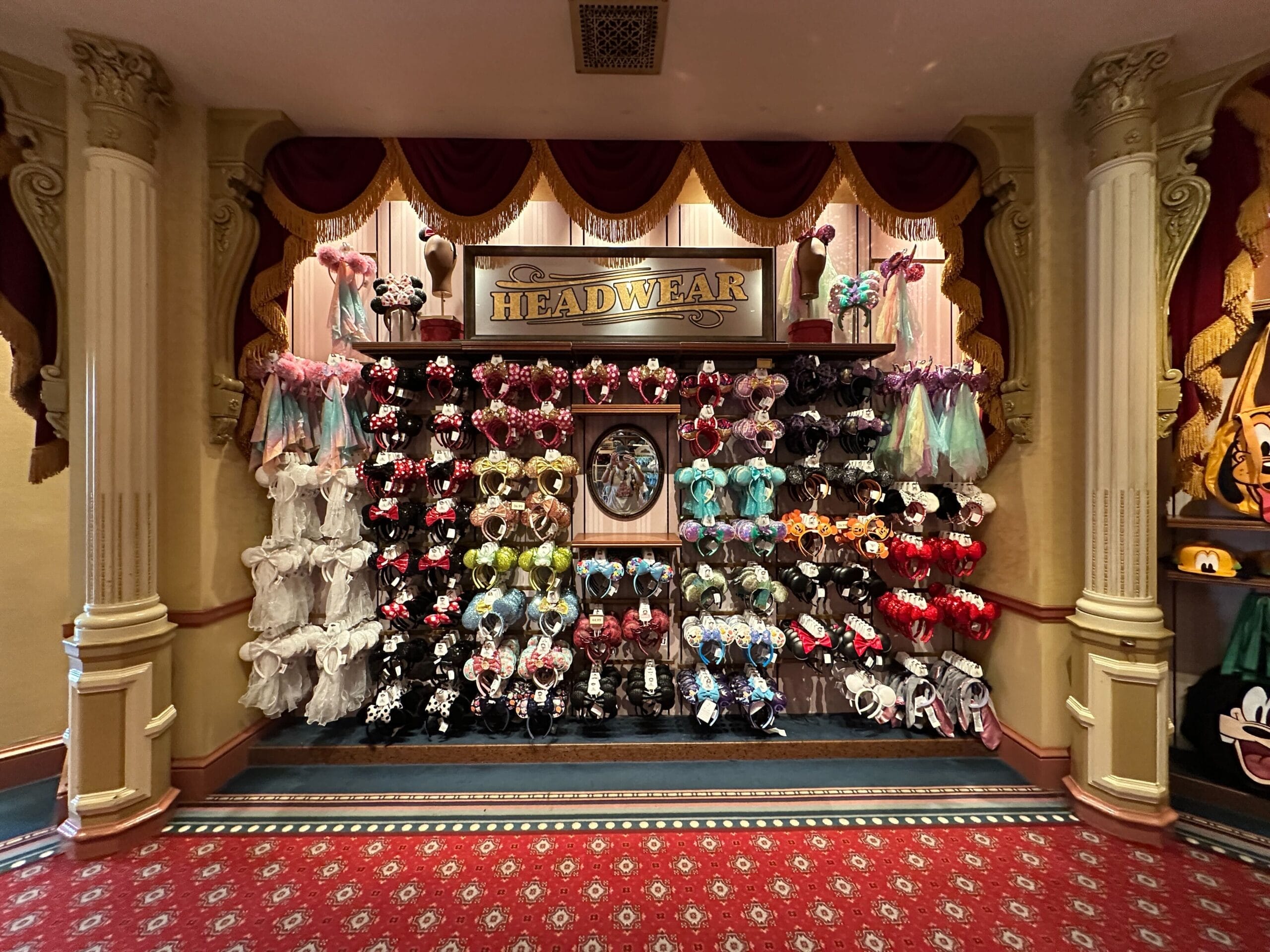A wall of ear headbands displayed at Emporium Shoppe in Magic Kingdom.
