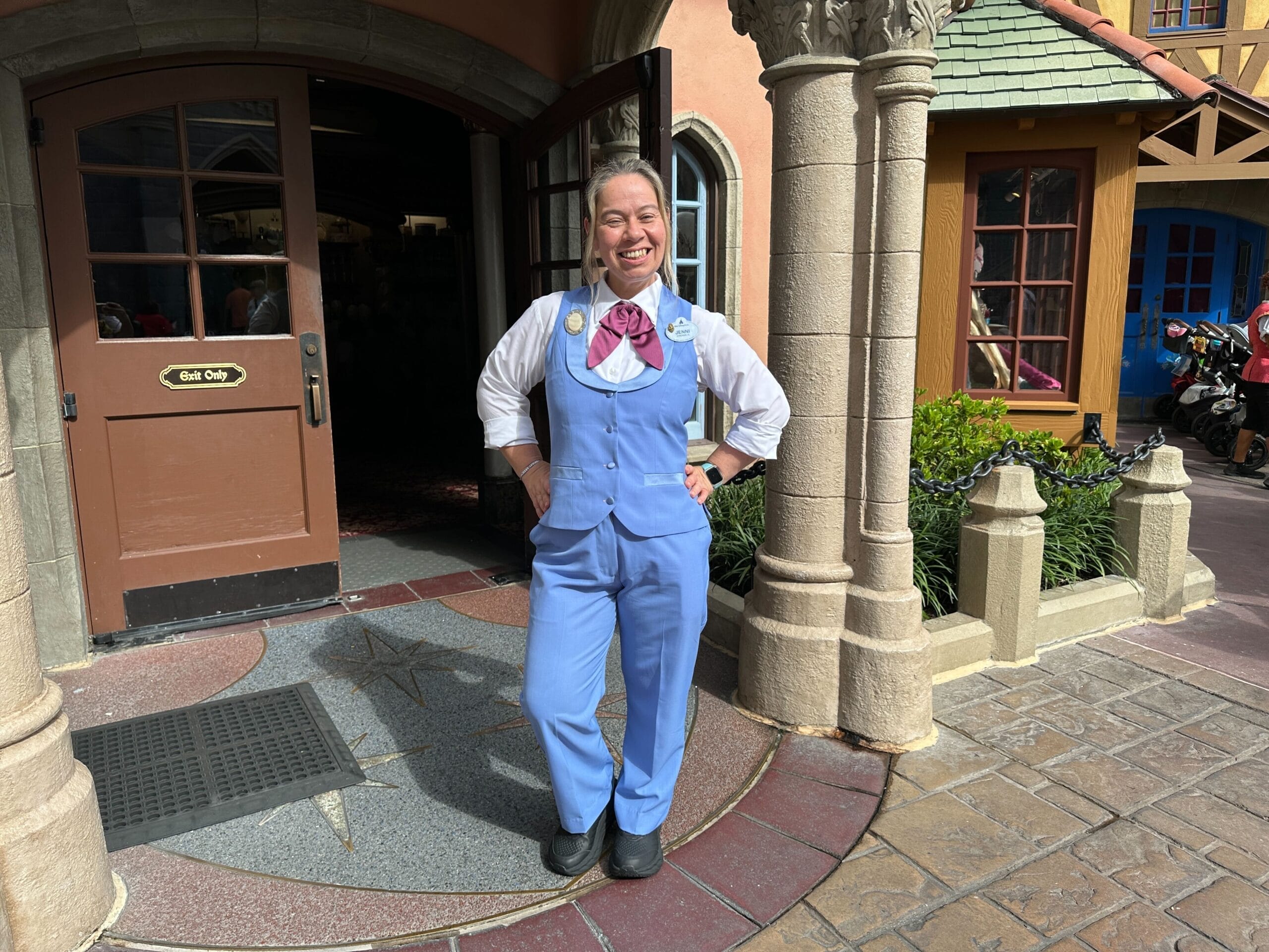A smiling cast member models the new Bibbidi Bobbidi Boutique costume at Magic Kingdom.