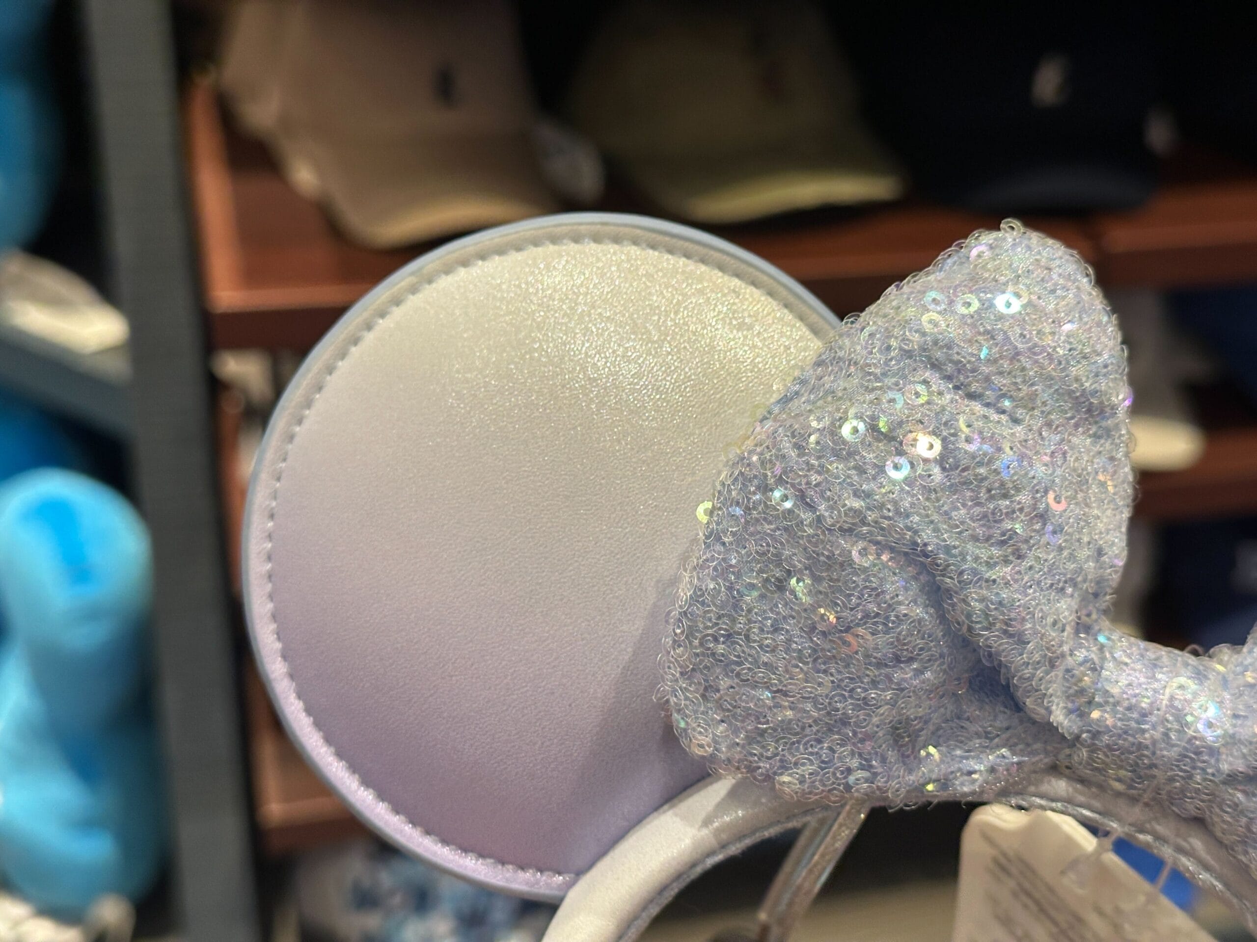 Sparkly silver mouse ear headband with sequin bow at Port Orleans Riverside Resort, a classic Walt Disney World hotel.