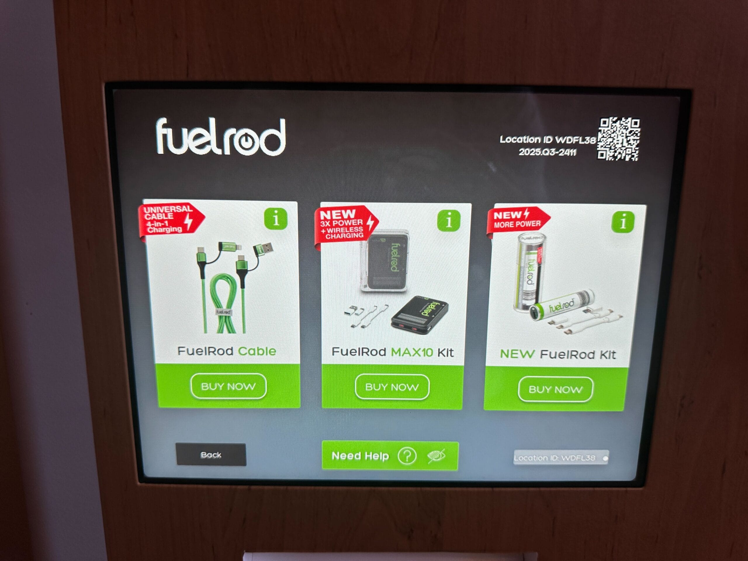 A touchscreen kiosk in a Disney park shows three FuelRod charger kits and cables, ready for purchase by guests on the go.