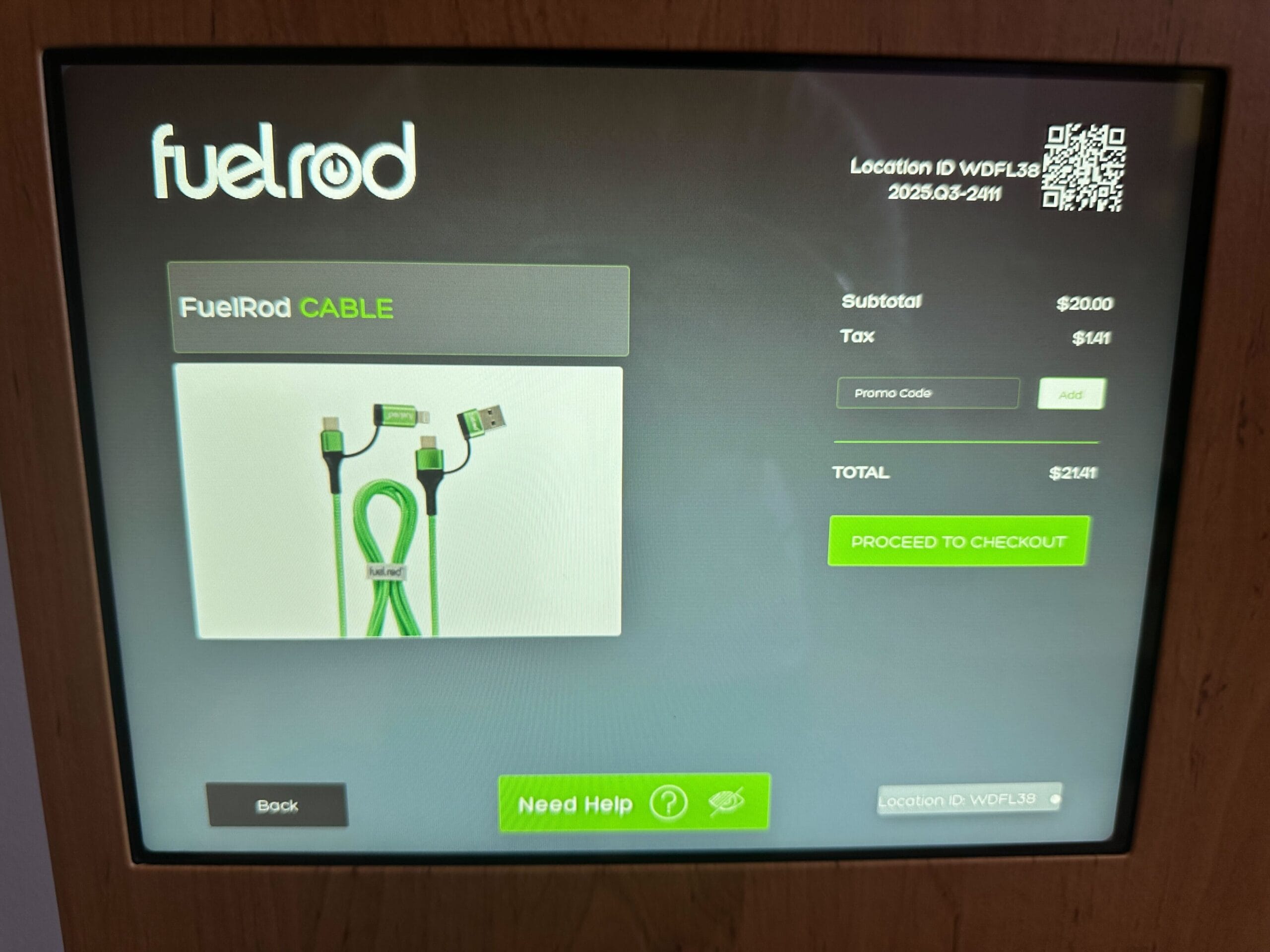 FuelRod kiosk screen at Disney park with green charging cable, pricing details, and "Proceed to Checkout" button visible.