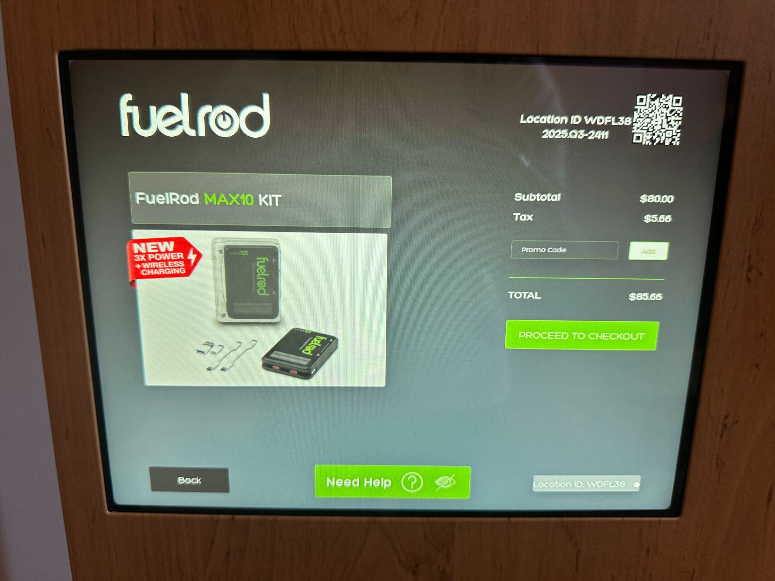 Touchscreen display at a Disney park showing a FuelRod MAX10 Kit product page with price, tax, and checkout options.