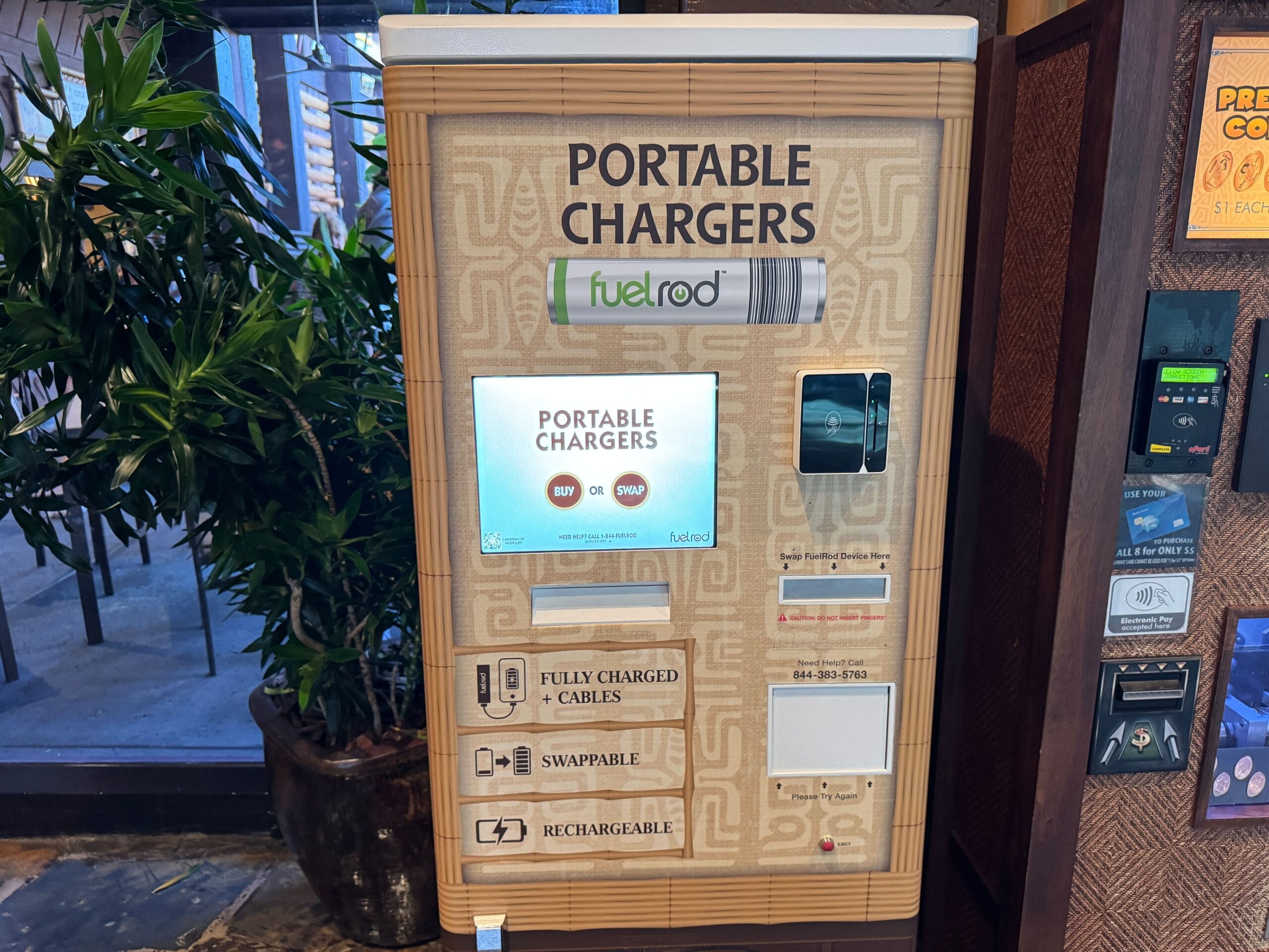 A FuelRod vending machine at a Disney park, offering swappable, fully charged portable battery packs for guests on the go.