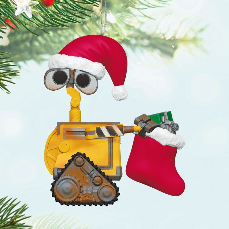 A Hallmark Disney ornament features WALL-E in a Santa hat with a red stocking, adding festive charm like Disney Park holiday décor.