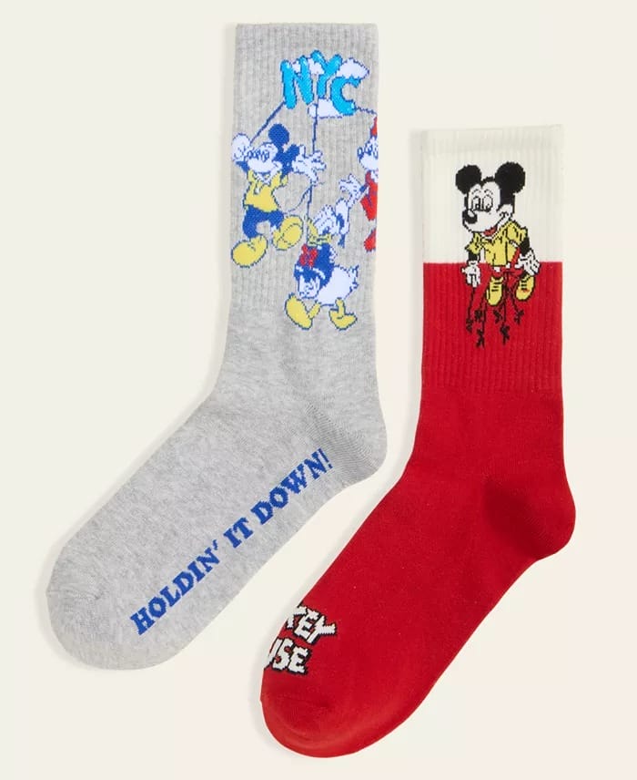 Mismatched socks: gray with cartoon ducks, red with Mickey Mouse—Disney Parks-inspired, reminiscent of festive park apparel.