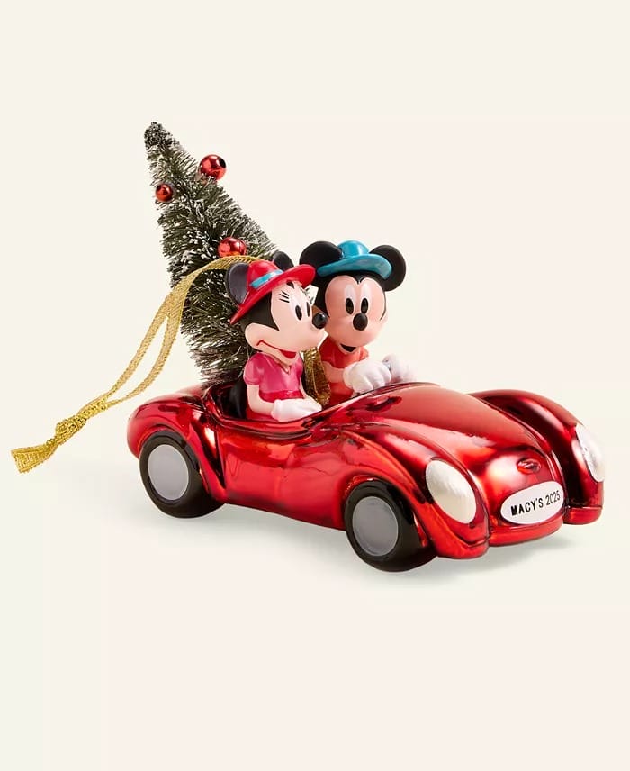 Mickey and Minnie drive a red car with a tree, "Macy's 2023." Part of the 2025 Holiday Collection; no Disney park castle shown.