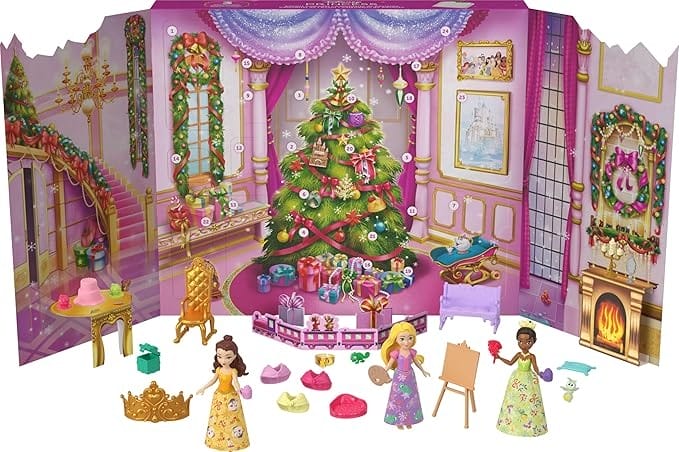 Three Disney princess dolls and accessories are displayed before a festive tree, perfect for Amazon Prime Big Deal Day.