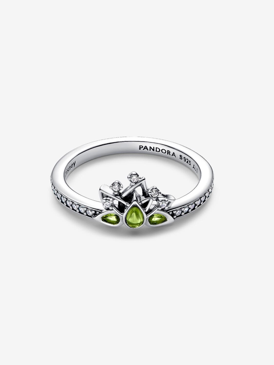 Pandora silver ring with clear and green gems in a Disney Princess crown design, reminiscent of Disneyland park castles, on white.