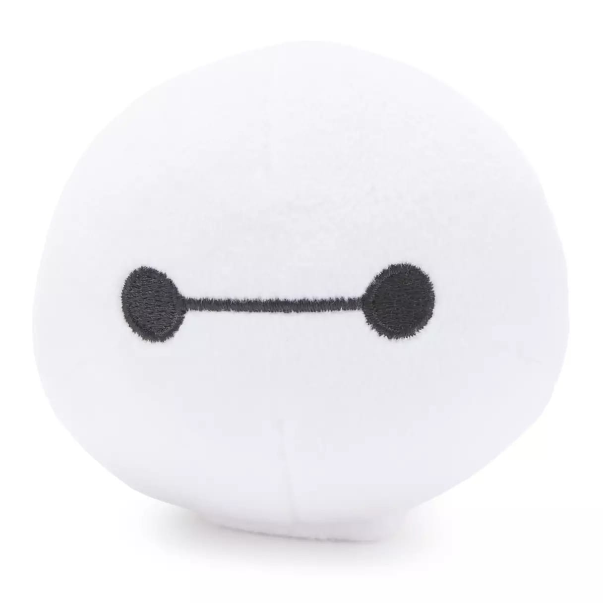 Round white plush toy styled like Baymax’s face from Big Hero 6, a popular character at Tokyo Disneyland, no castle in view.